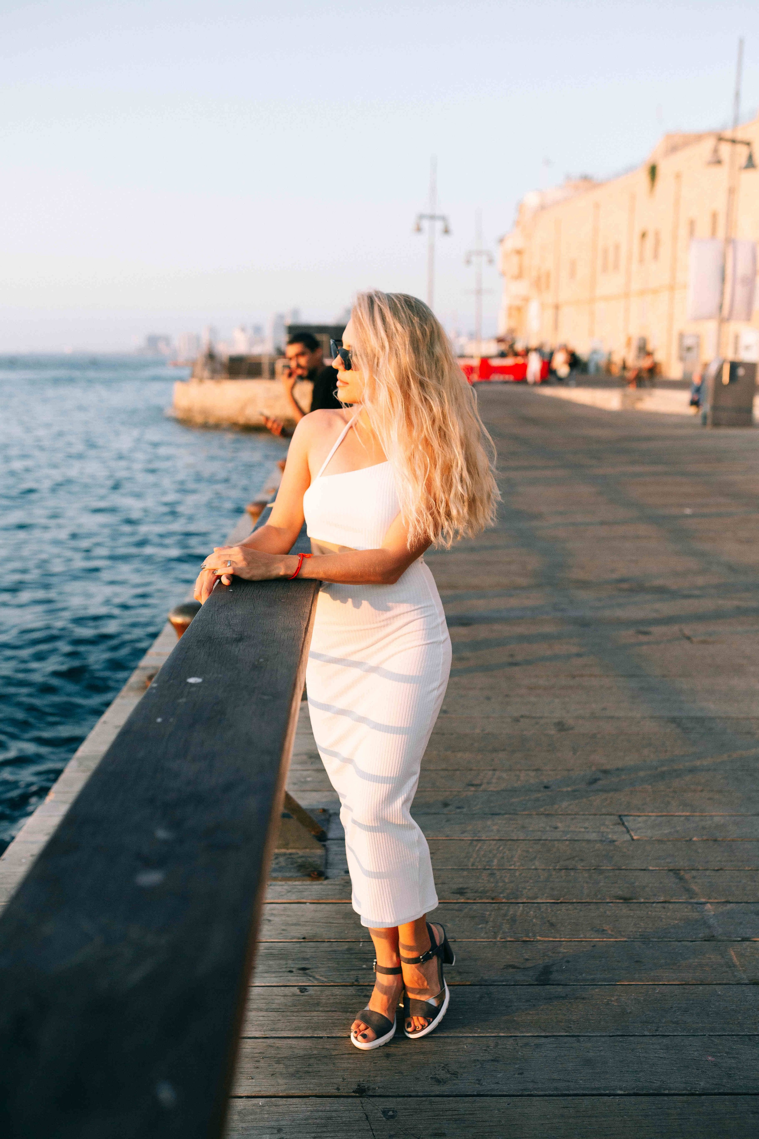 SUNSET IN JAFFO PORT. PHOTOGRAPHER IN ISRAEL