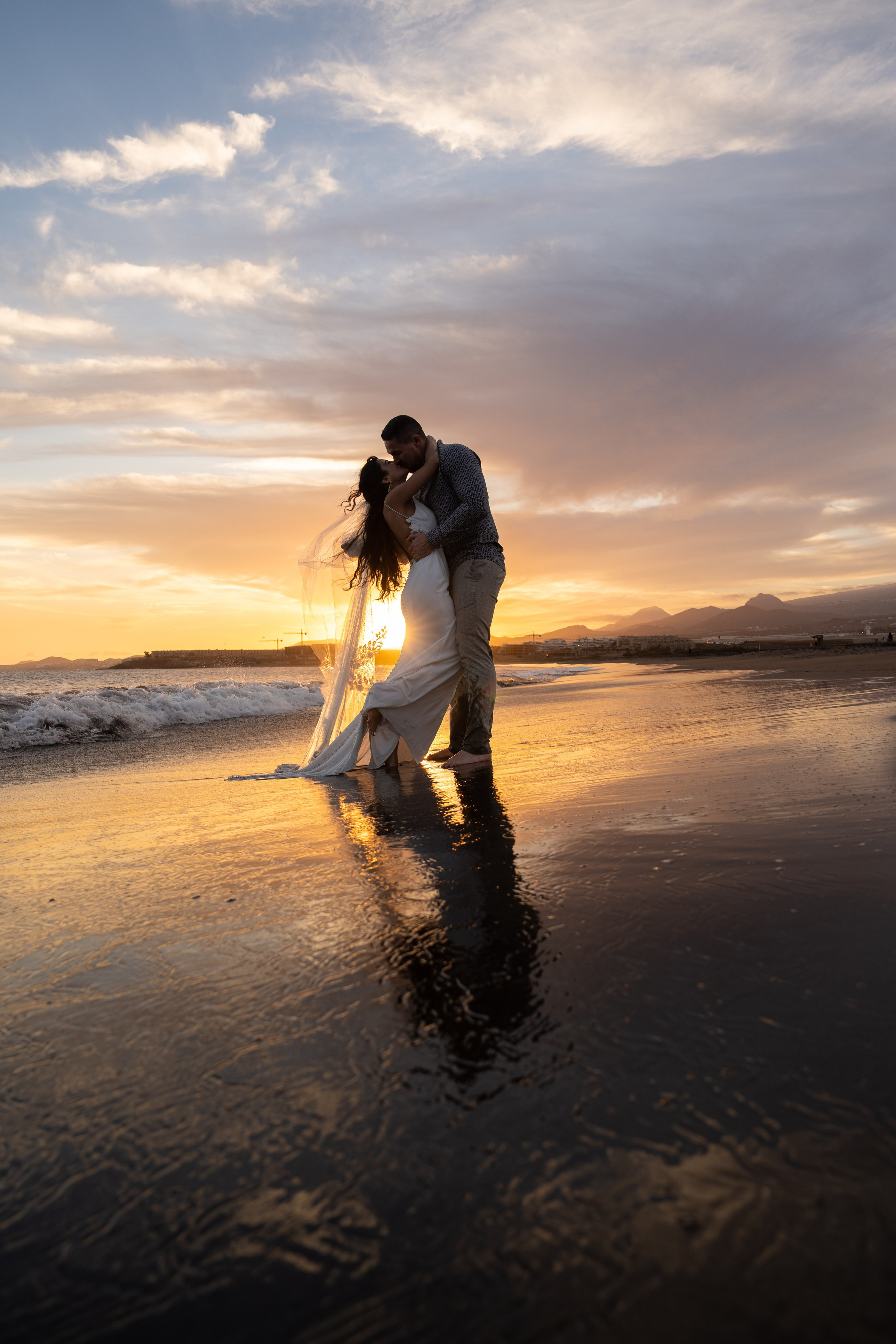 married couple at the sunset