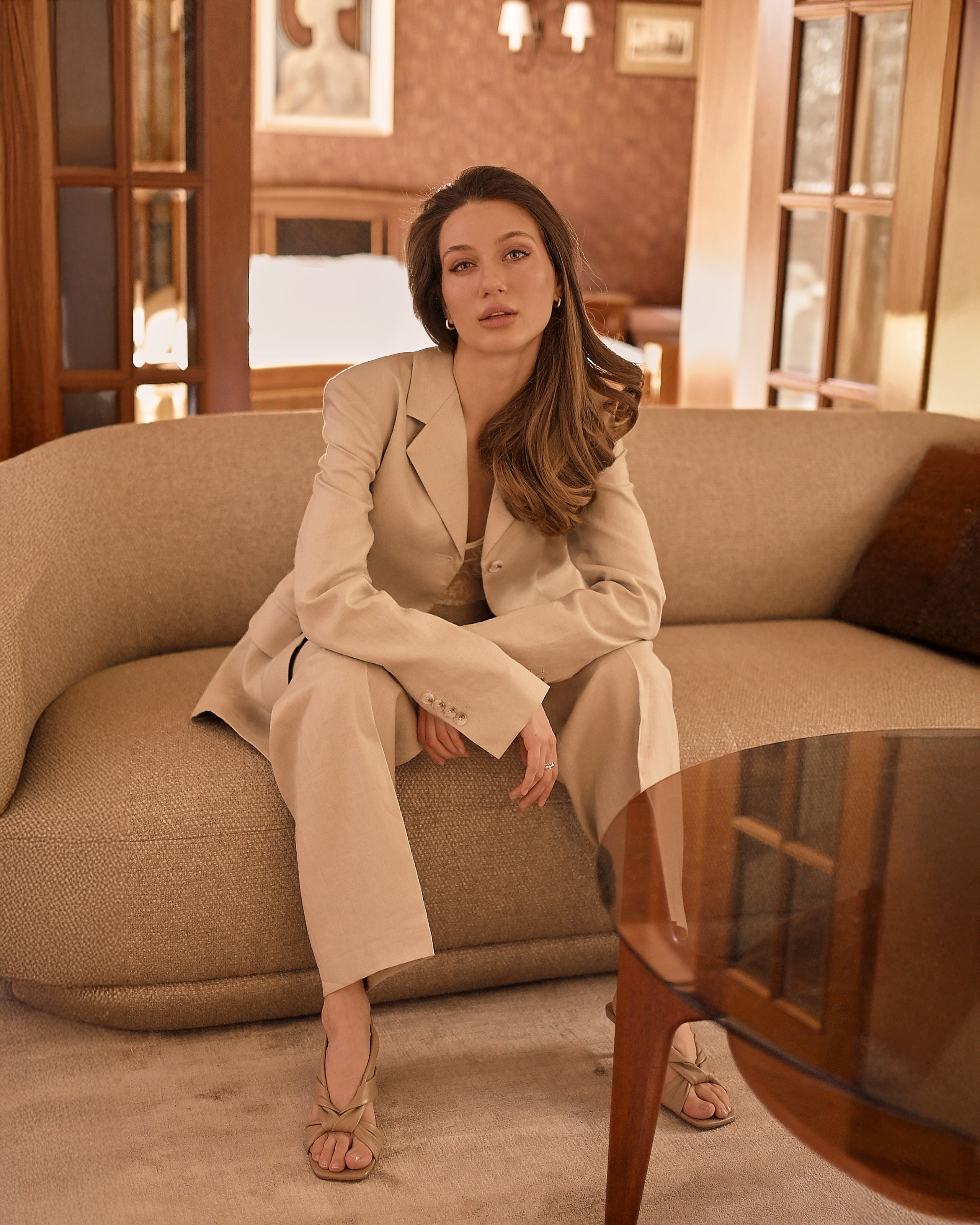 Corporate headshot of professional woman in bright minimalist workspace