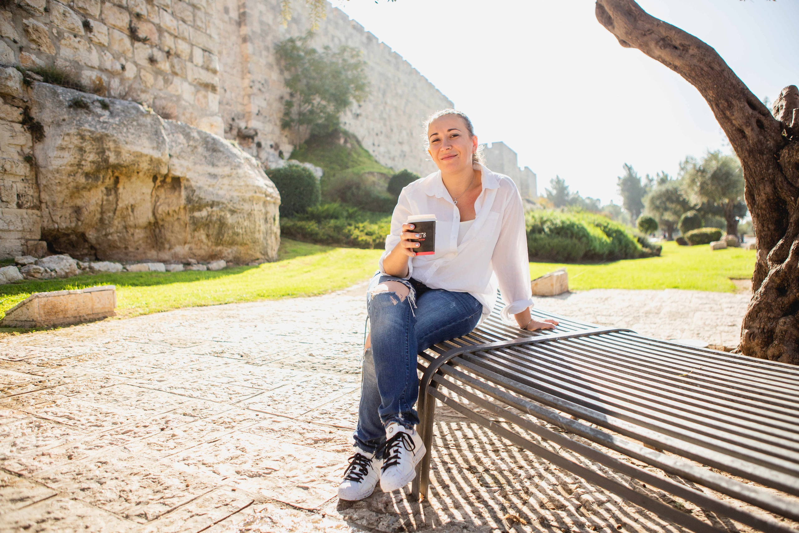 AT THE WALLS OF THE OLD CITY. PHOTOGRAPHER IN ISRAEL