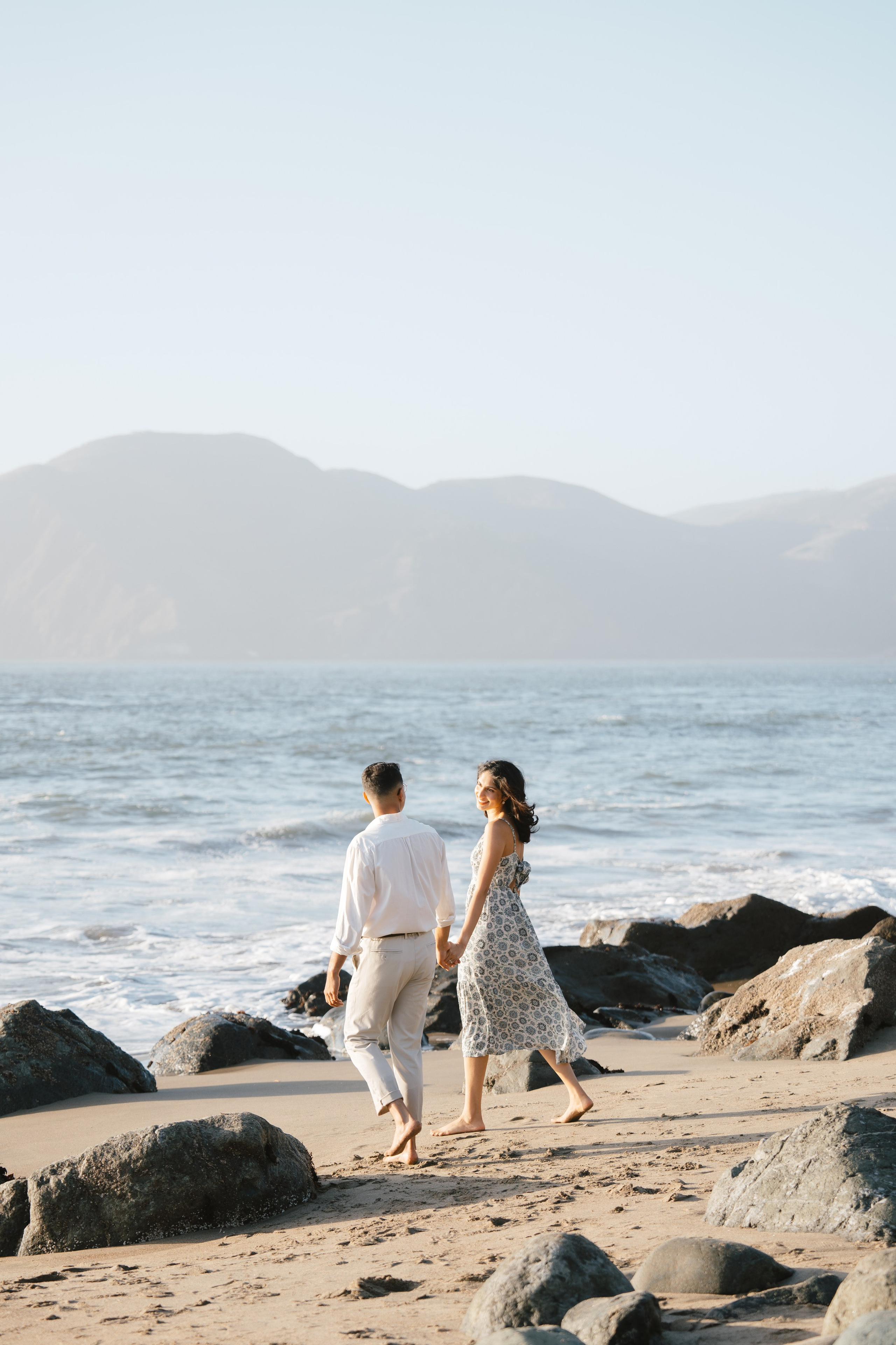 Engagement and Couple’s Photoshoot at Marshall’s Beach with iconic Golden Gate bridge view. Soulo Photography | San Francisco Bay Area Based Photographer