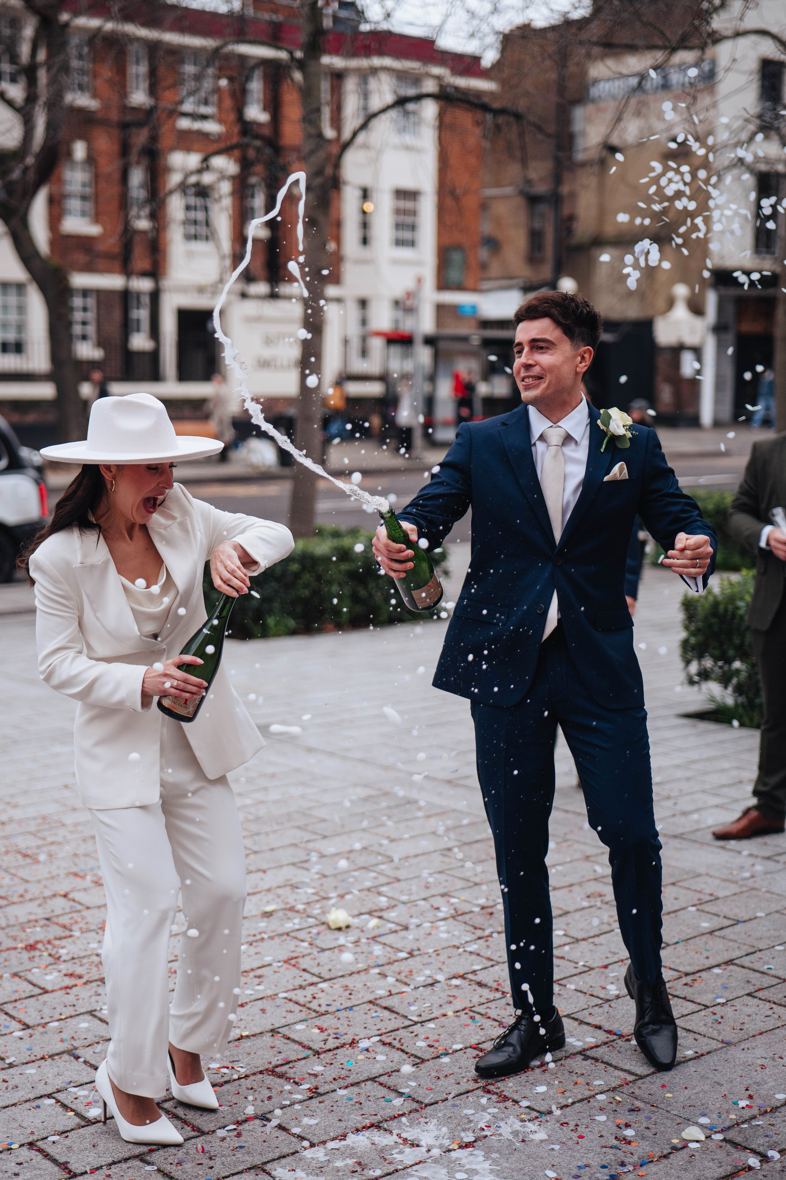 Exit from Islington town hall, champagne bottle opening 