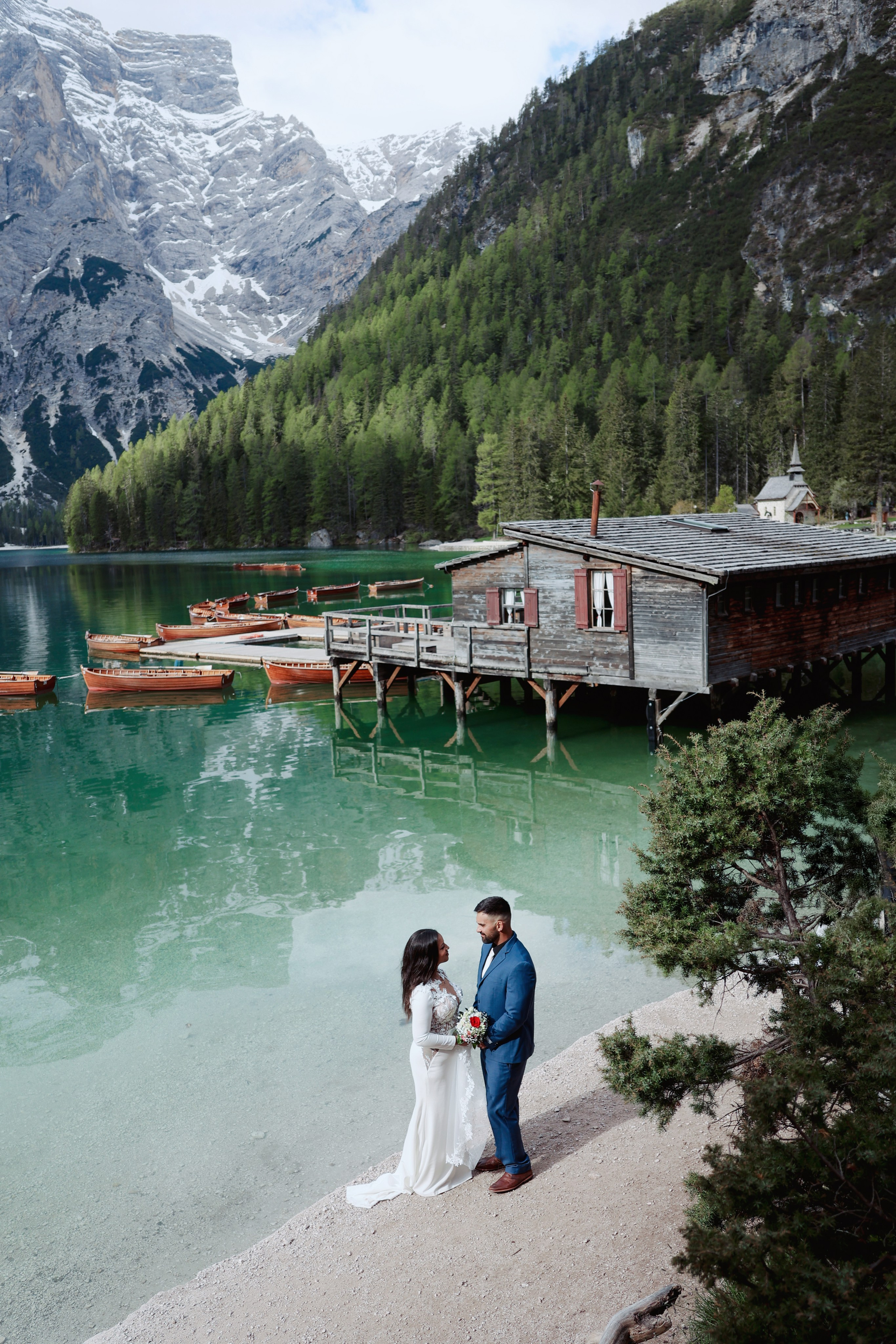 Sunrise elopement photo session at Lago di Braies, Italy