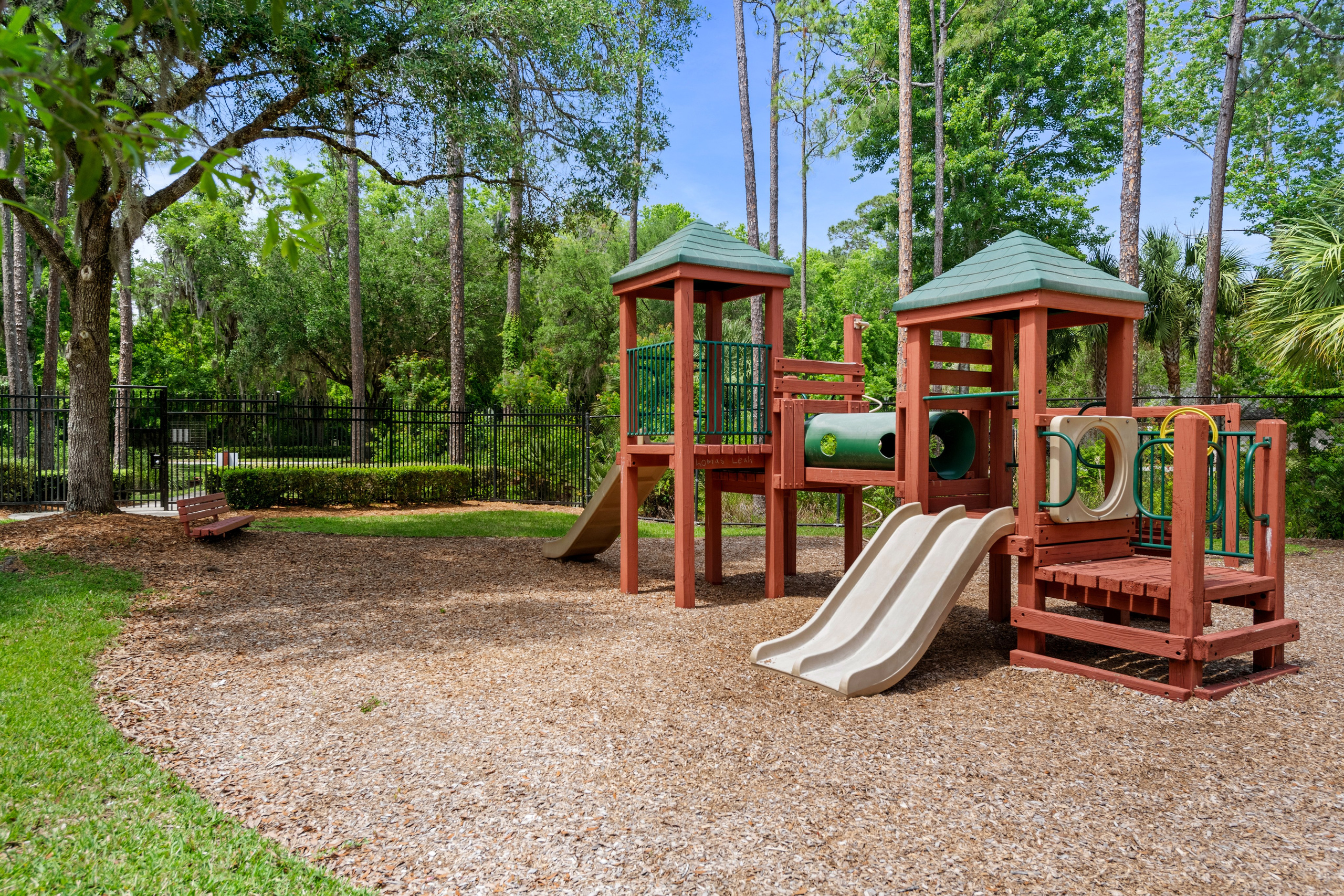 Children’s playground with slides and wooden climbing structures