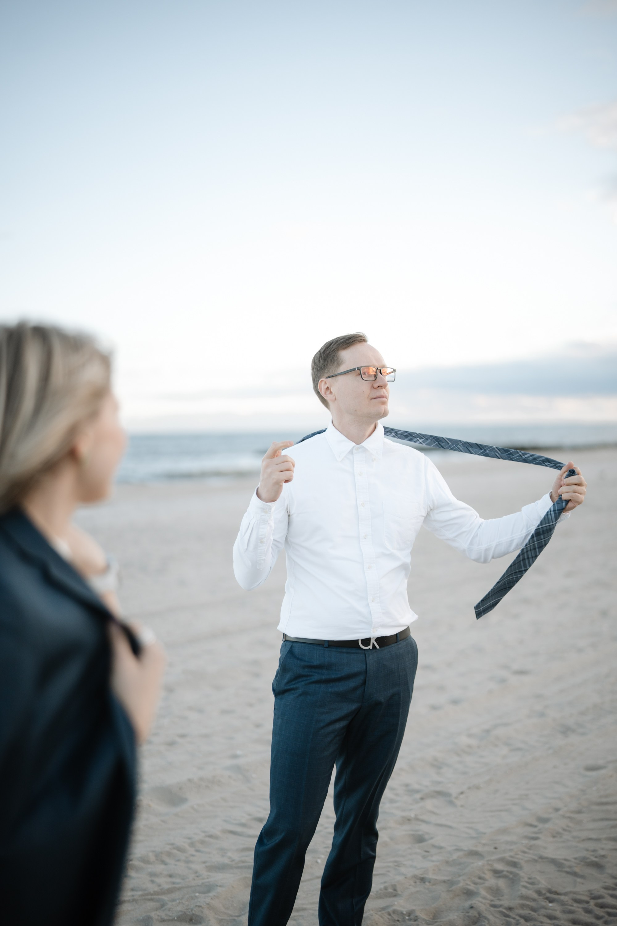 Candid photos of a couple on the beach. Portrait and wedding photographer in New York