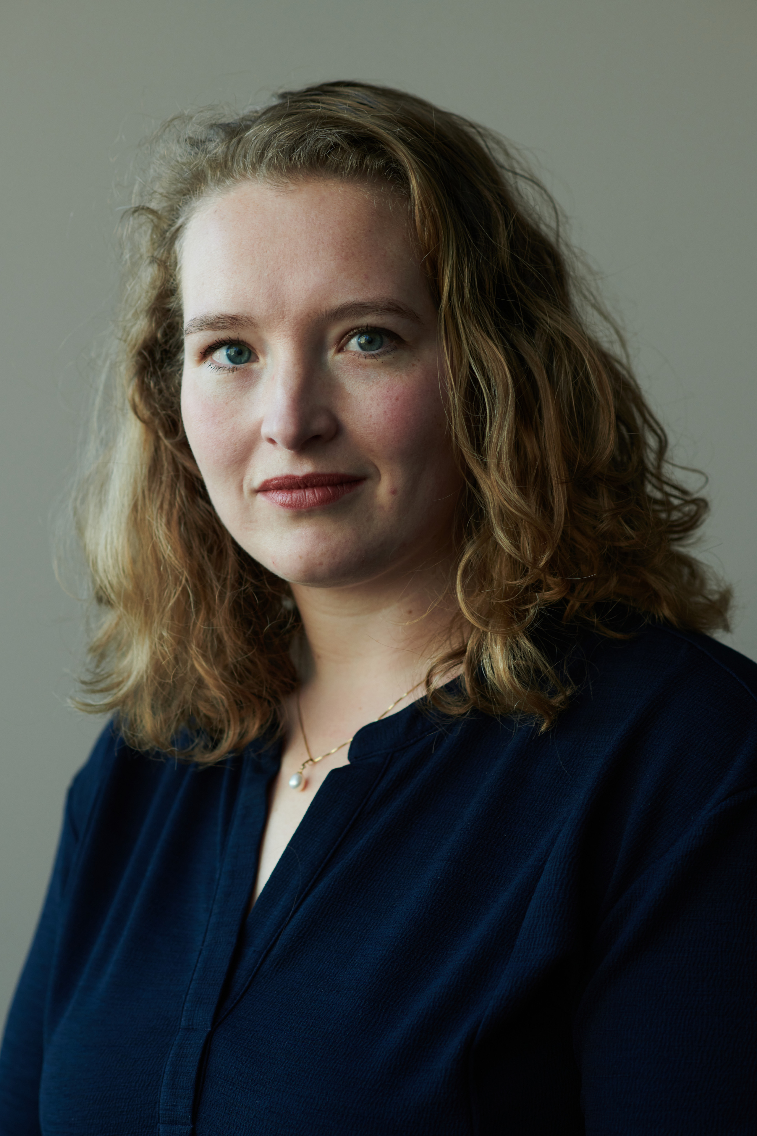 Female business portrait photographer photoshoot of a young woman in studio Amsterdam location