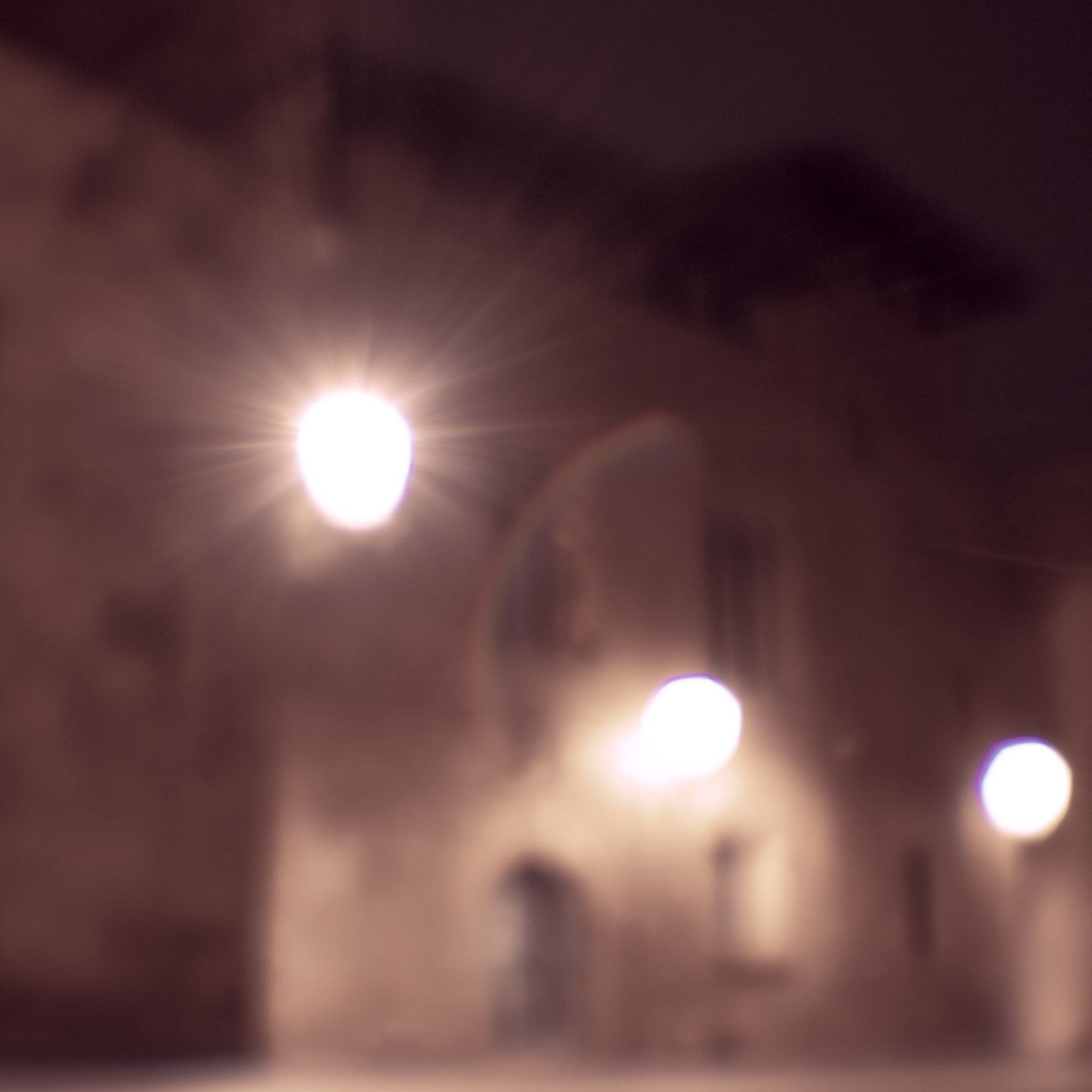 Intimate night walk in Barcelona with blurred, film-like street scenes.