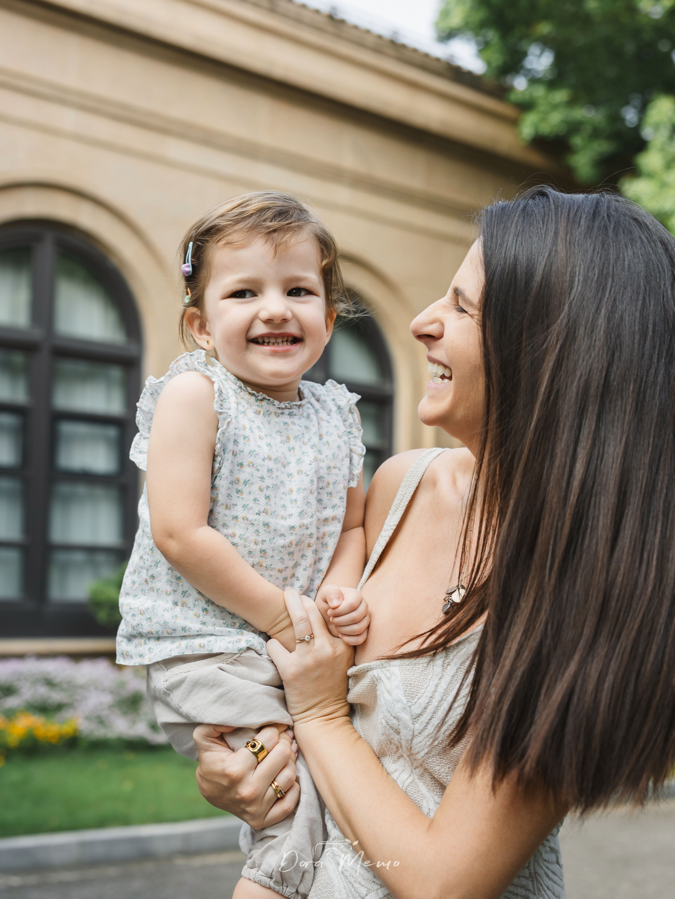 Mom holding the youngest daughter close | Mother holding her toddler daughter, soft natural light, intimate moment