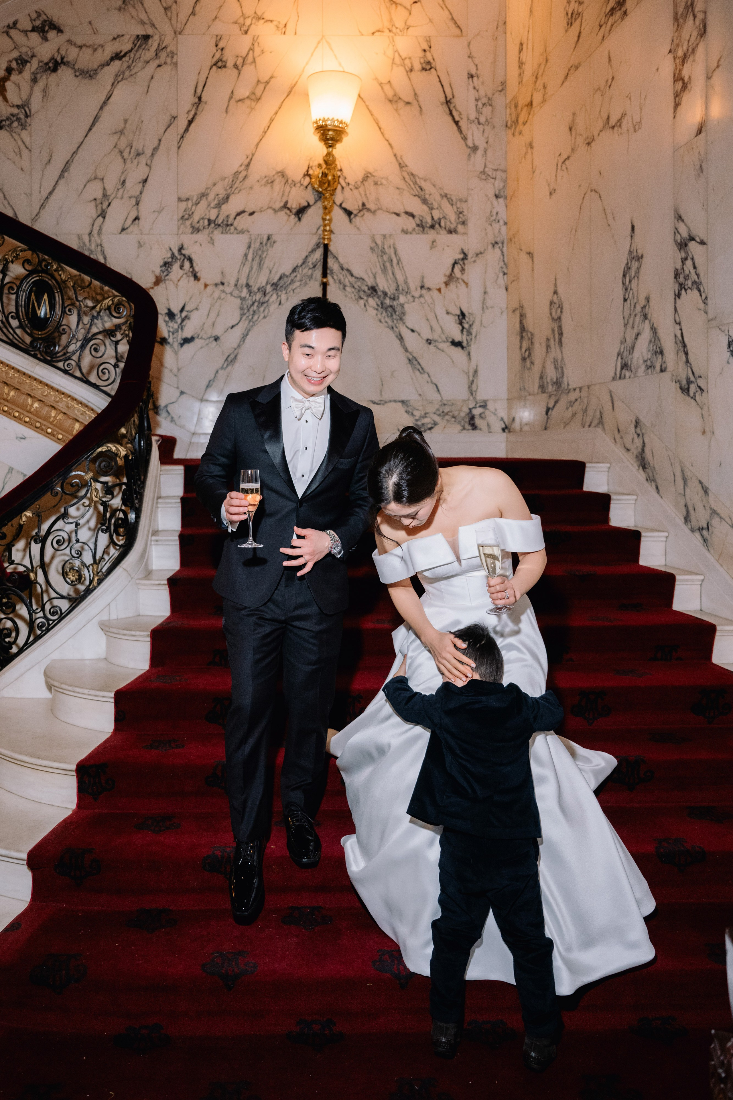 a man and woman sitting on a red carpet