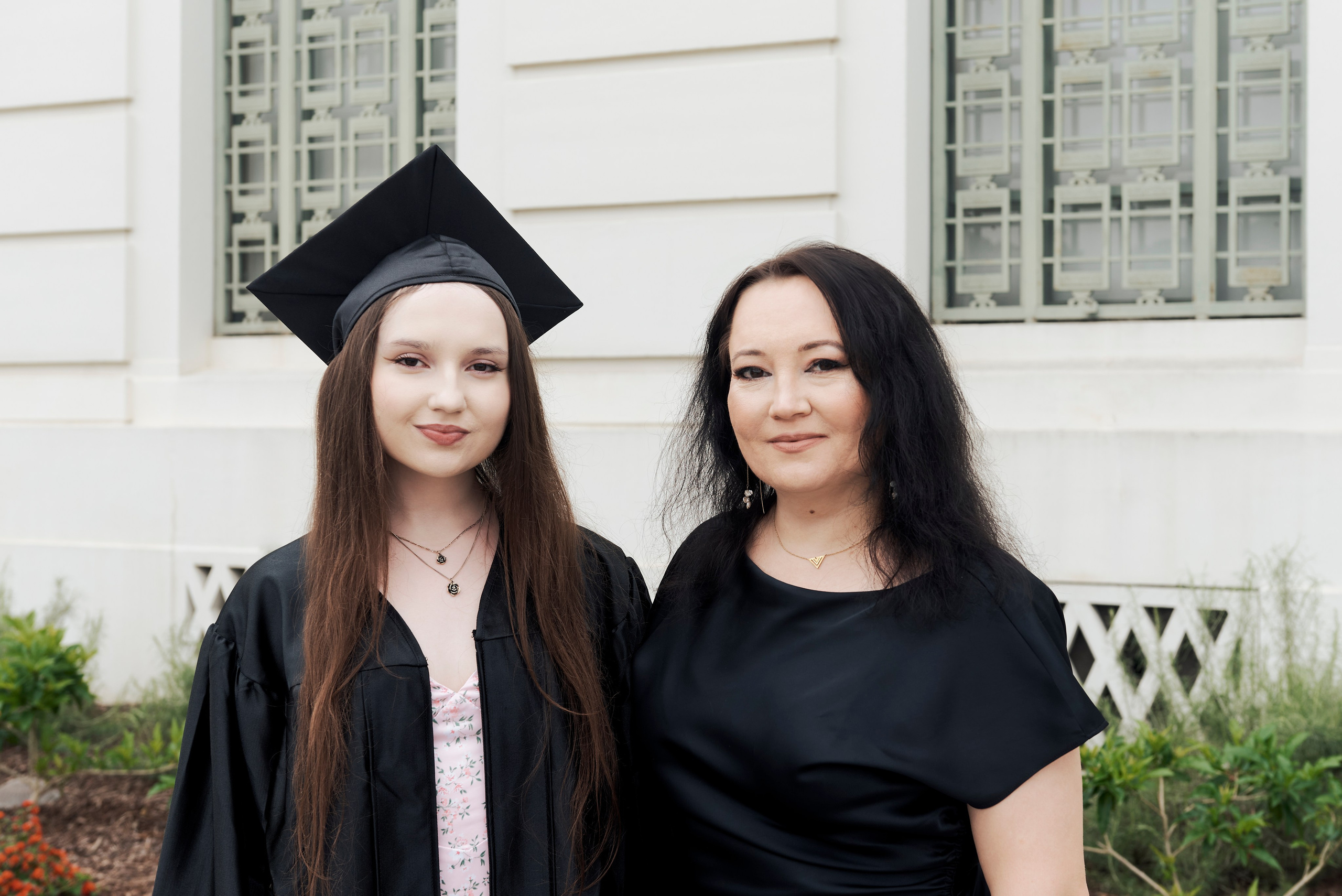 Happy graduate celebrating with family at a Los Angeles graduation ceremony