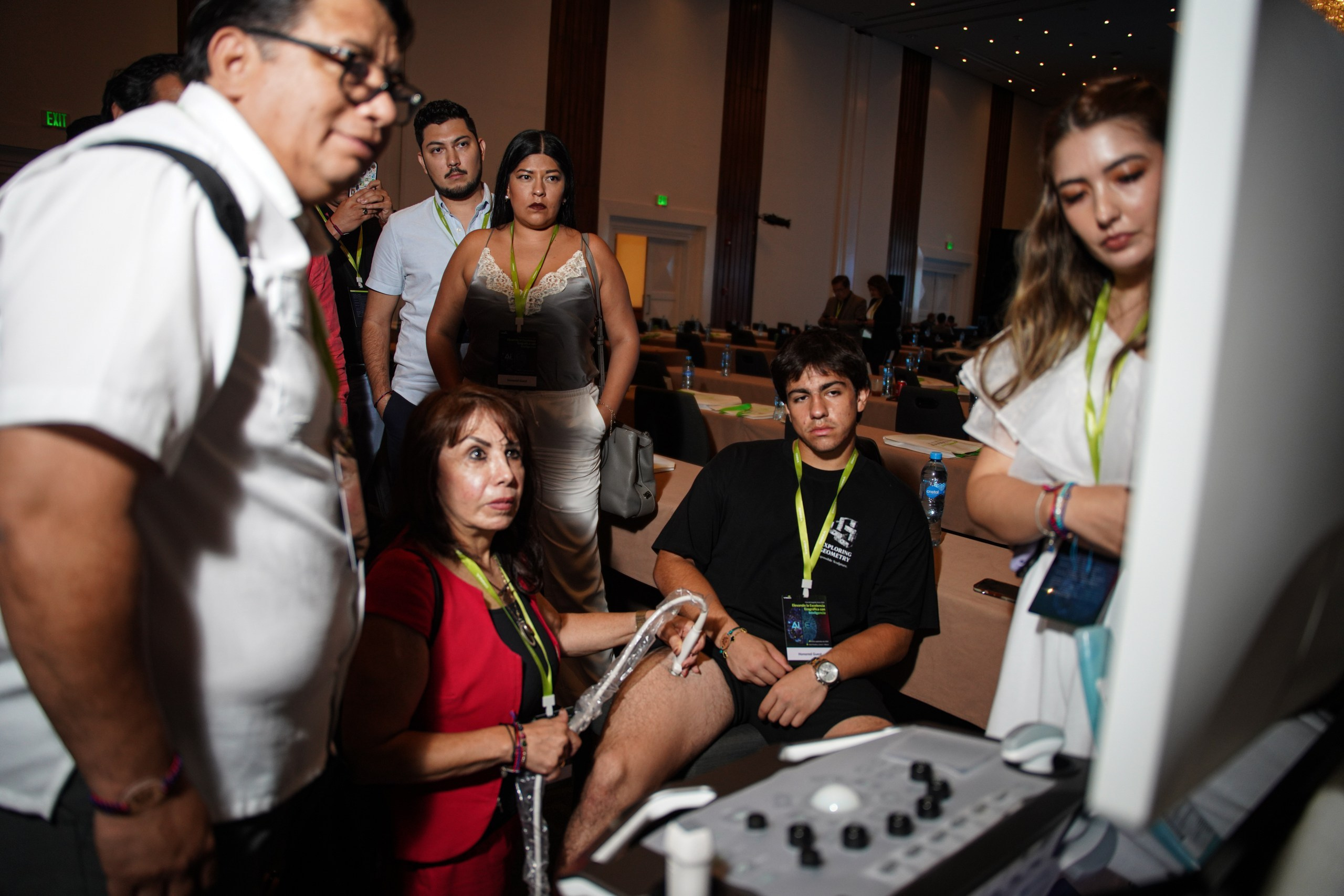 Attendees comparing equipment performance during live presentation.