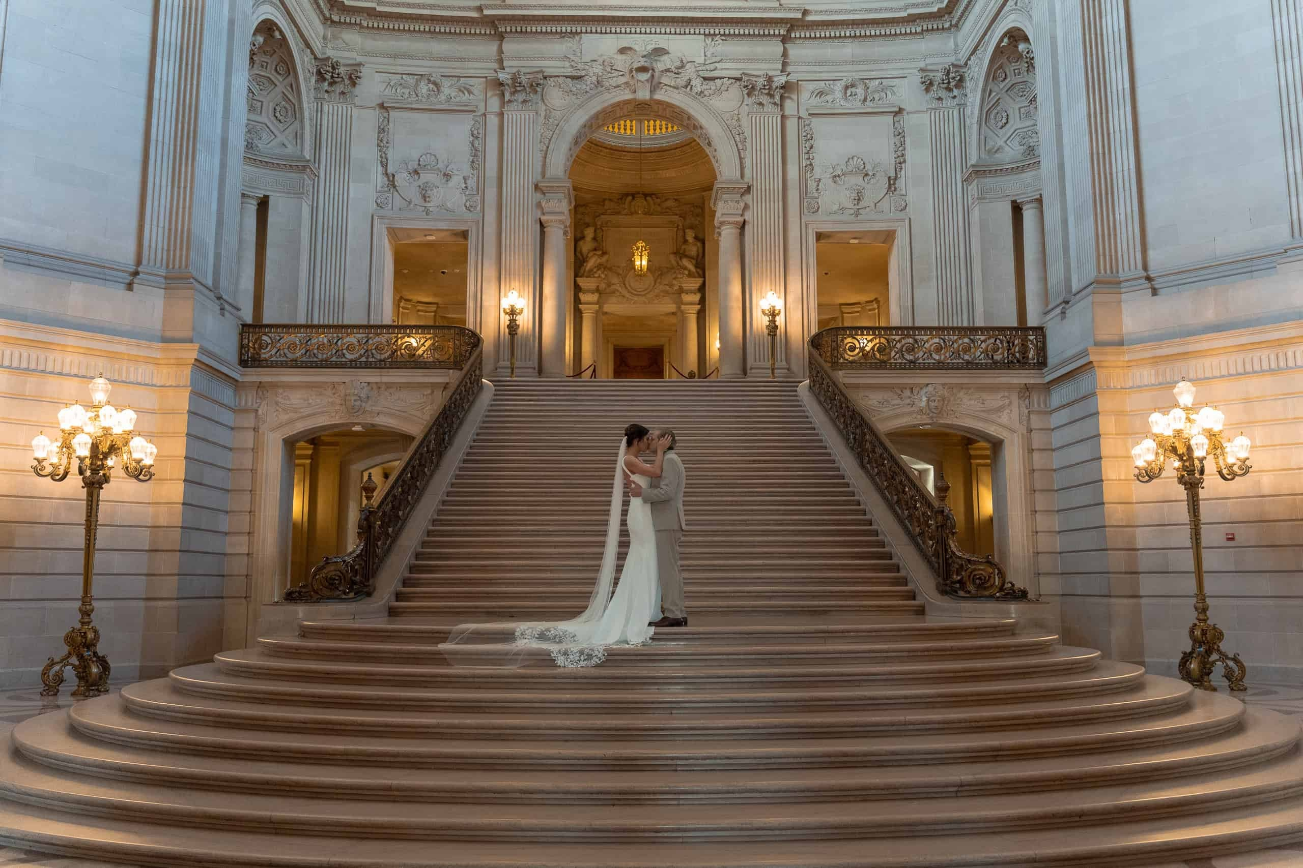 Couple on the grand staircase at San Francisco City Hall