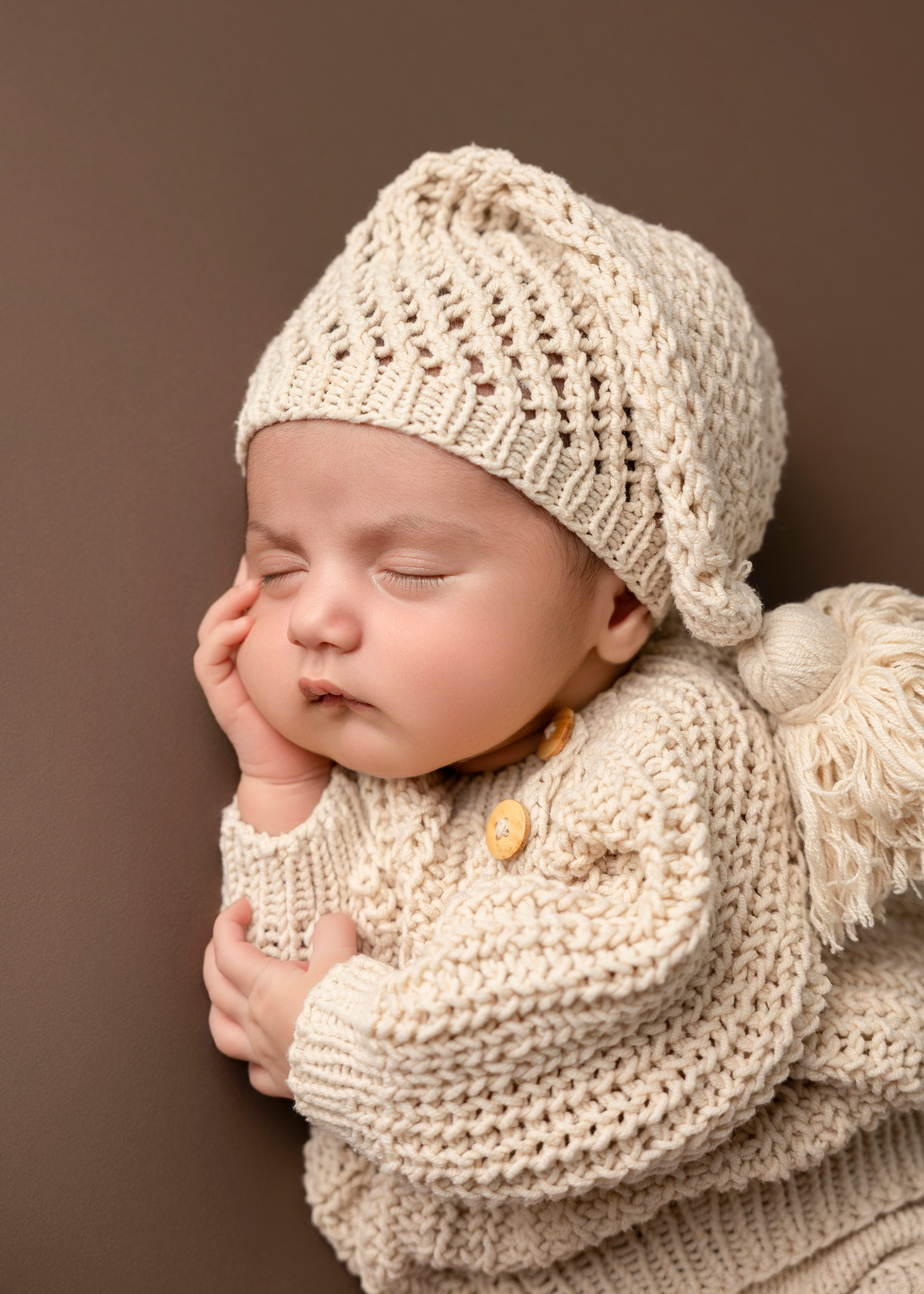 newborn portrait in beige and brown colors
