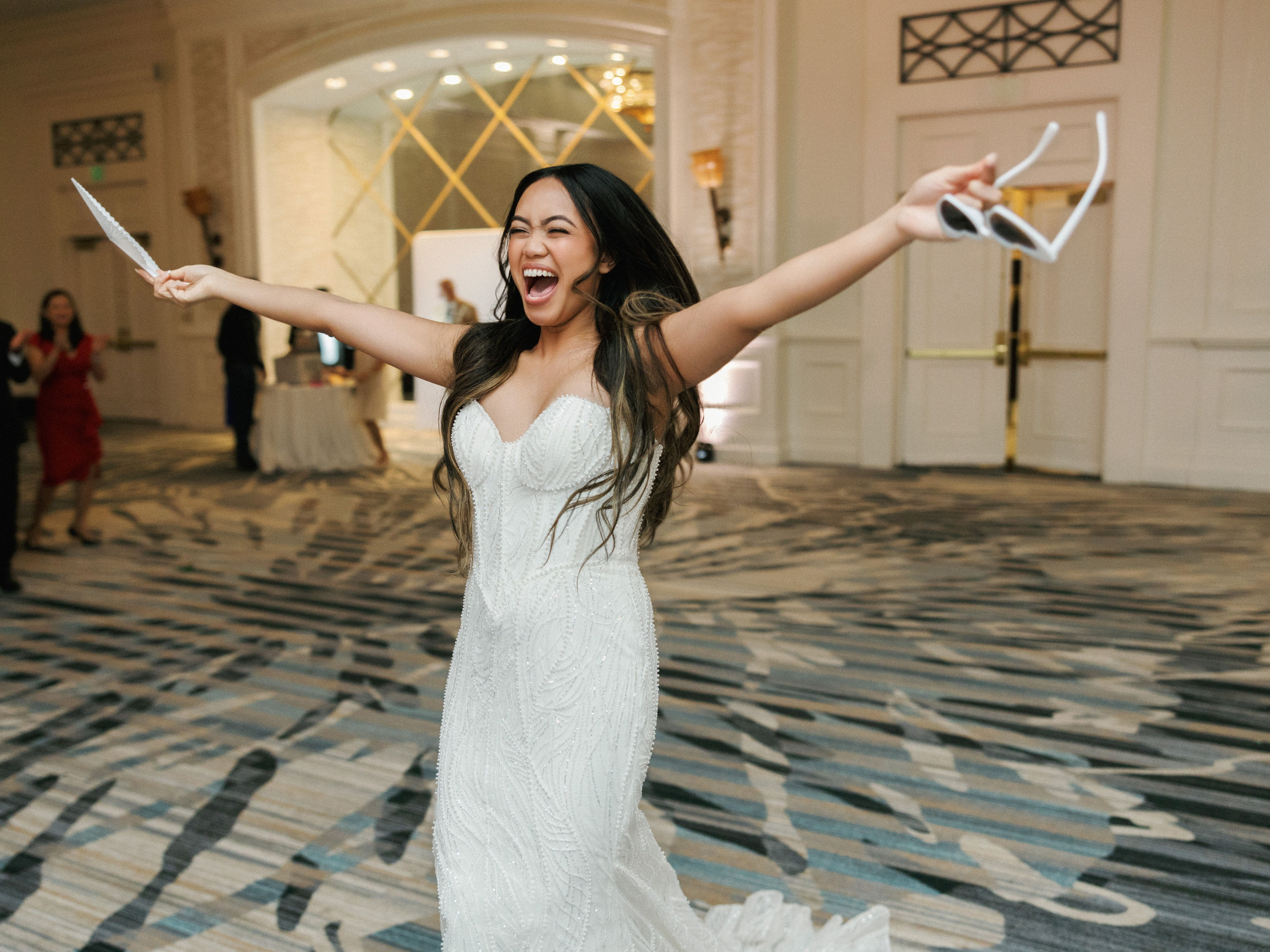 Bride celebrating on the dance floor at her reception