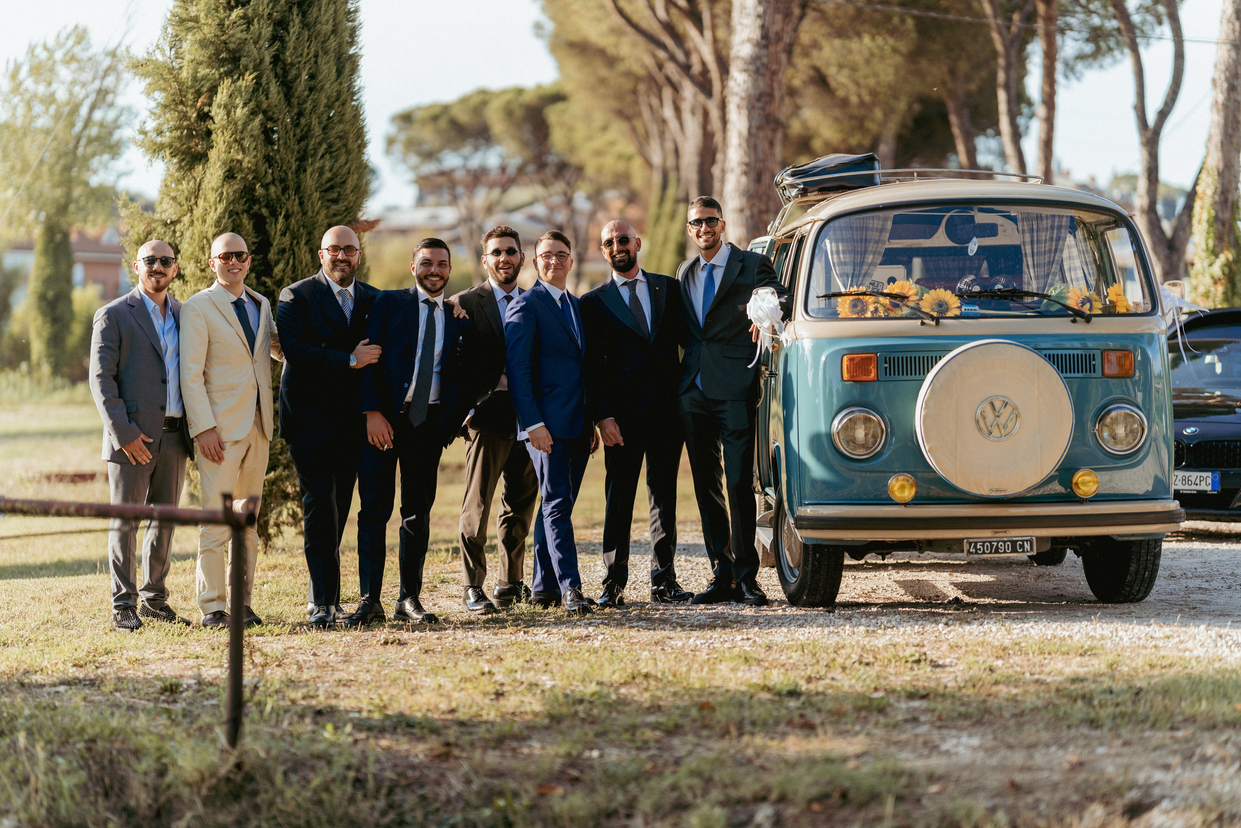 Newlyweds celebrating with family and friends at an outdoor wedding.