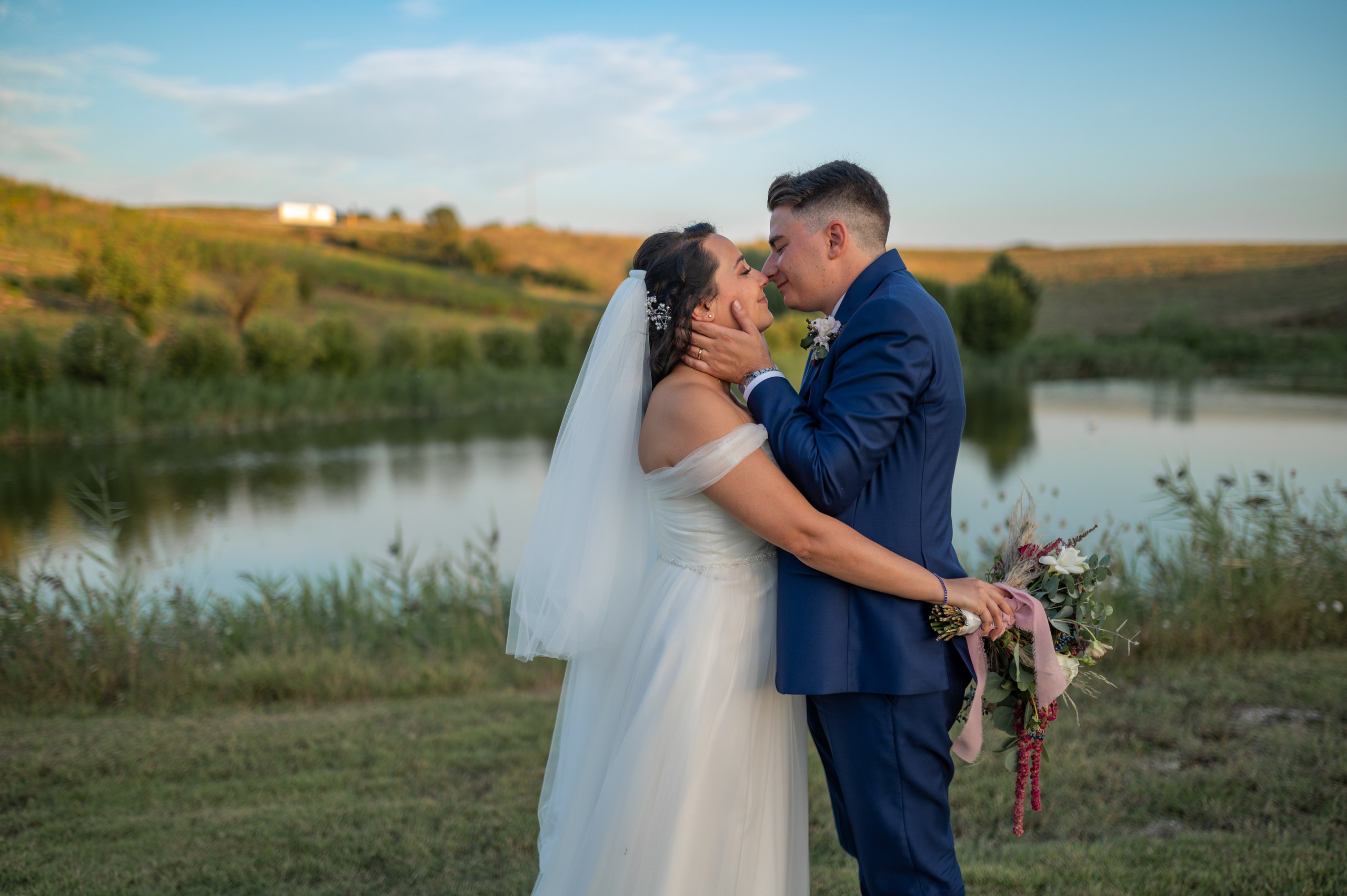 Bride and groom sharing a warm embrace during their wedding celebration.