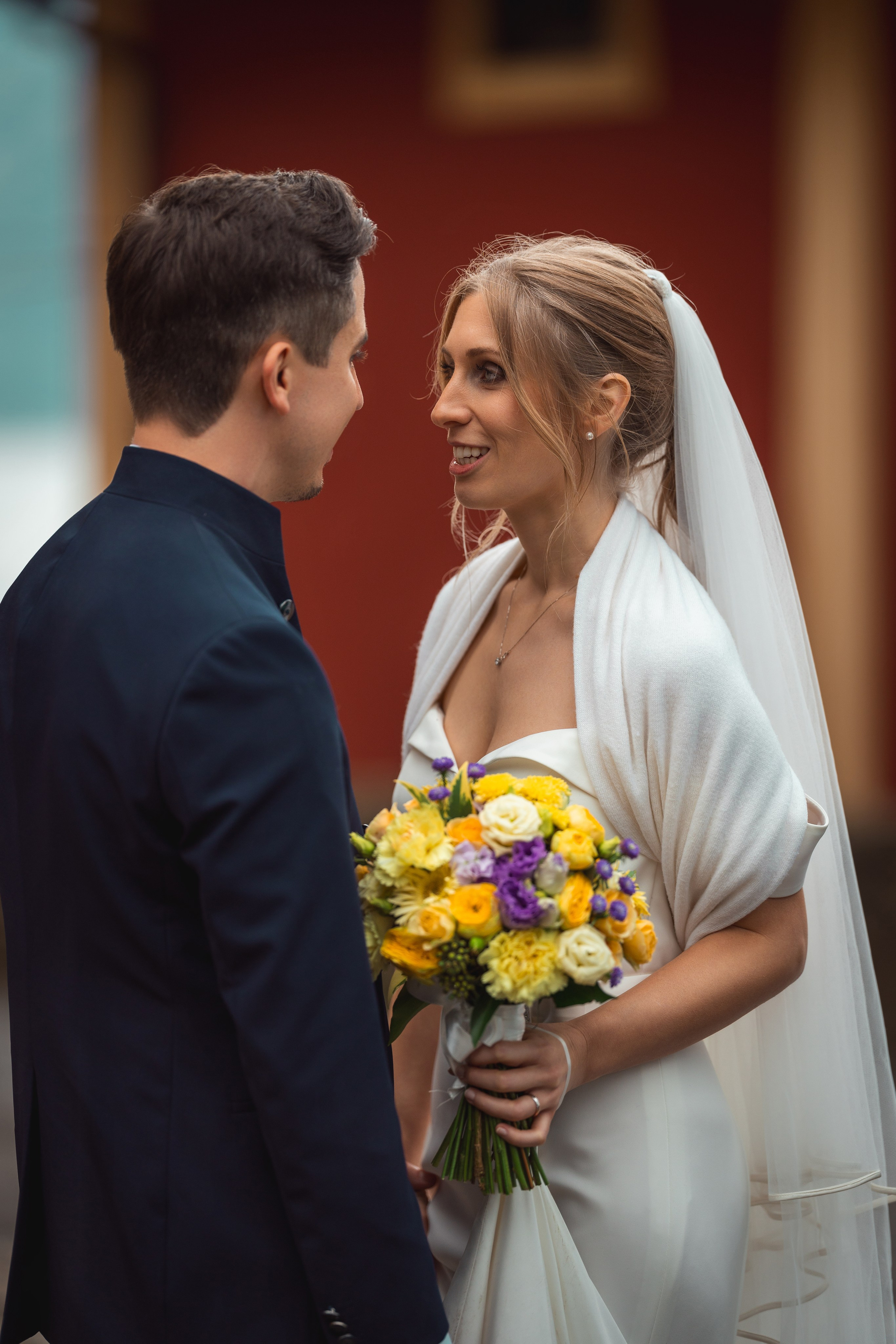 Wedding portrait of the newlyweds surrounded by soft natural light.
