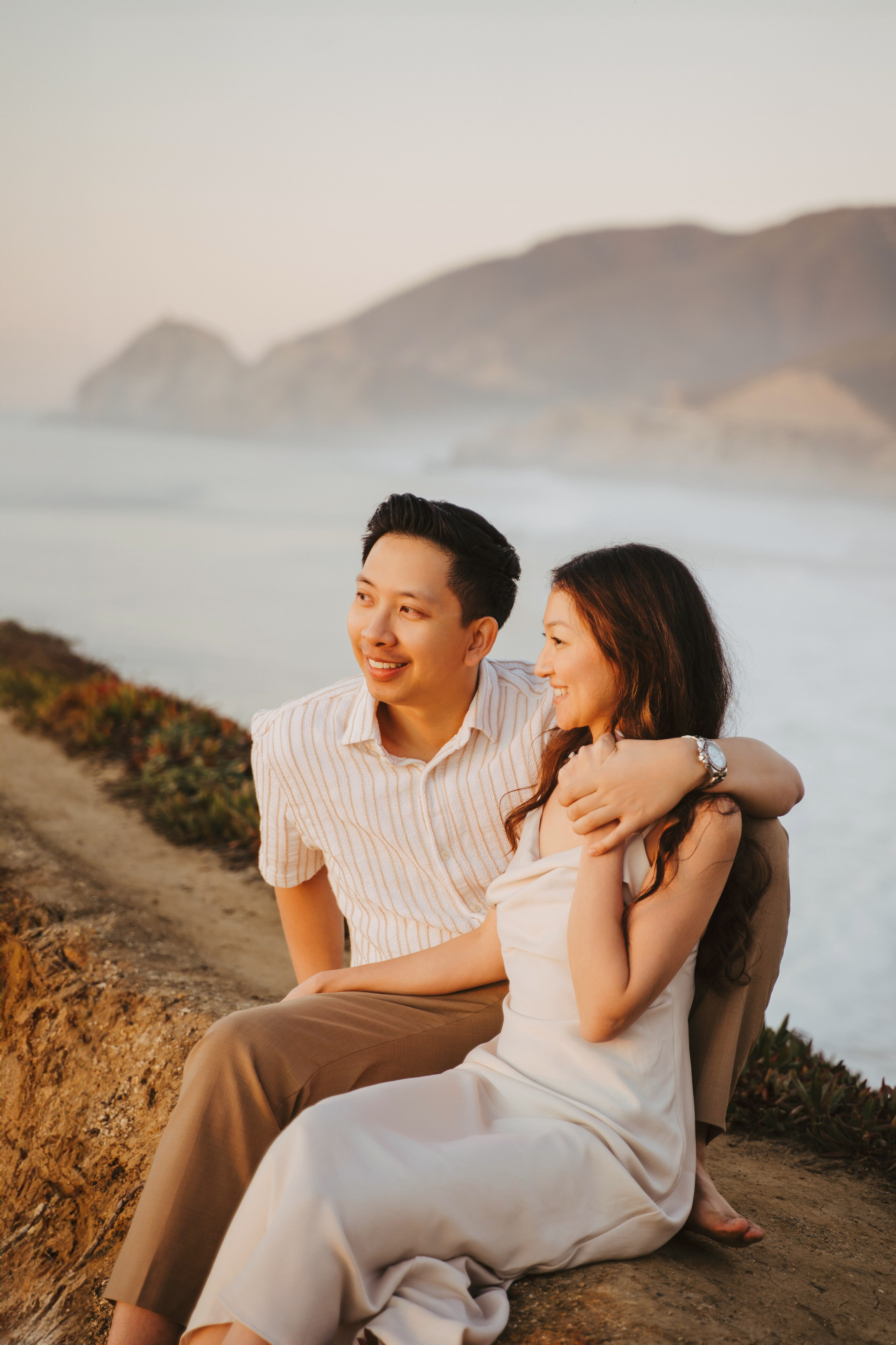 A photo shoot on the San Francisco beach at sunset. Engagement session. 