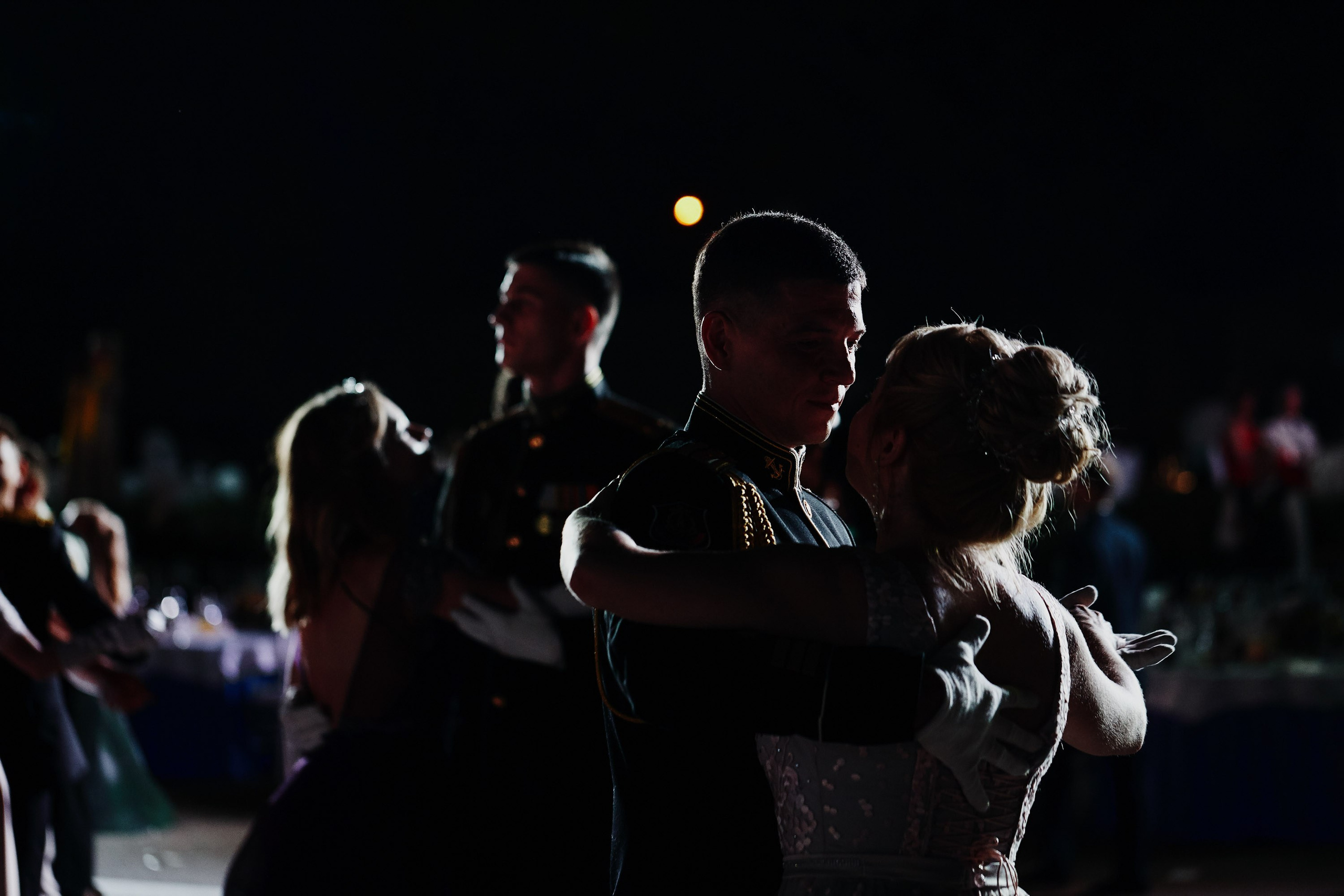 Group of people dancing at night party