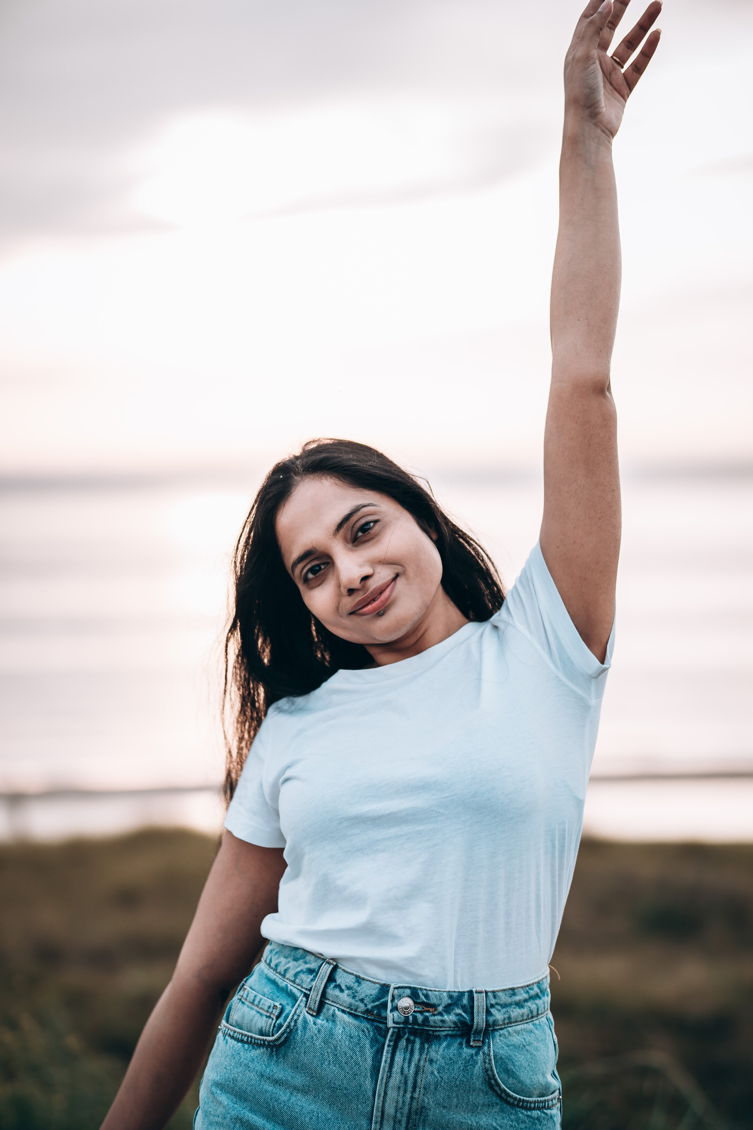 Model standing on a beach