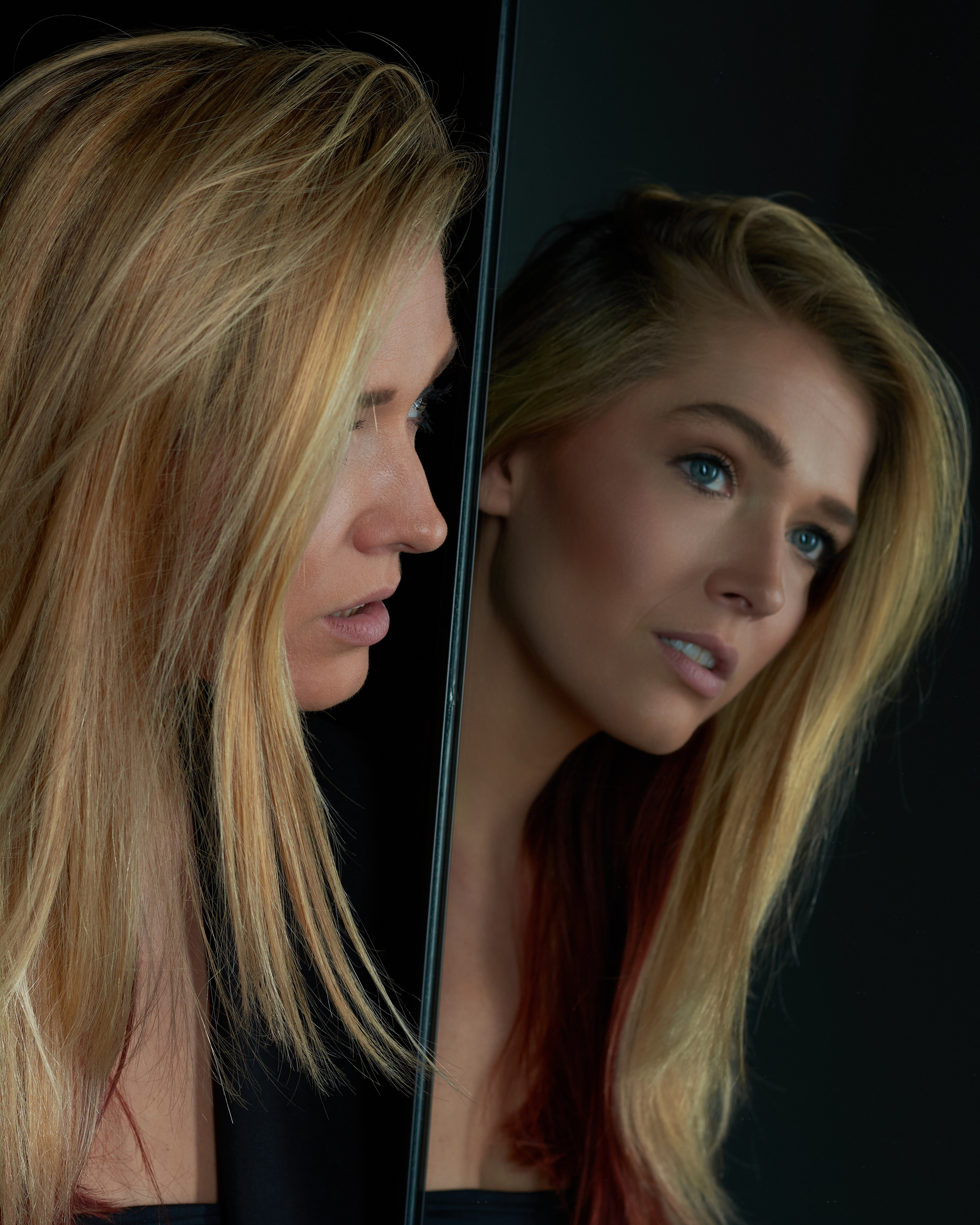 Two faces divided by mirror's edge