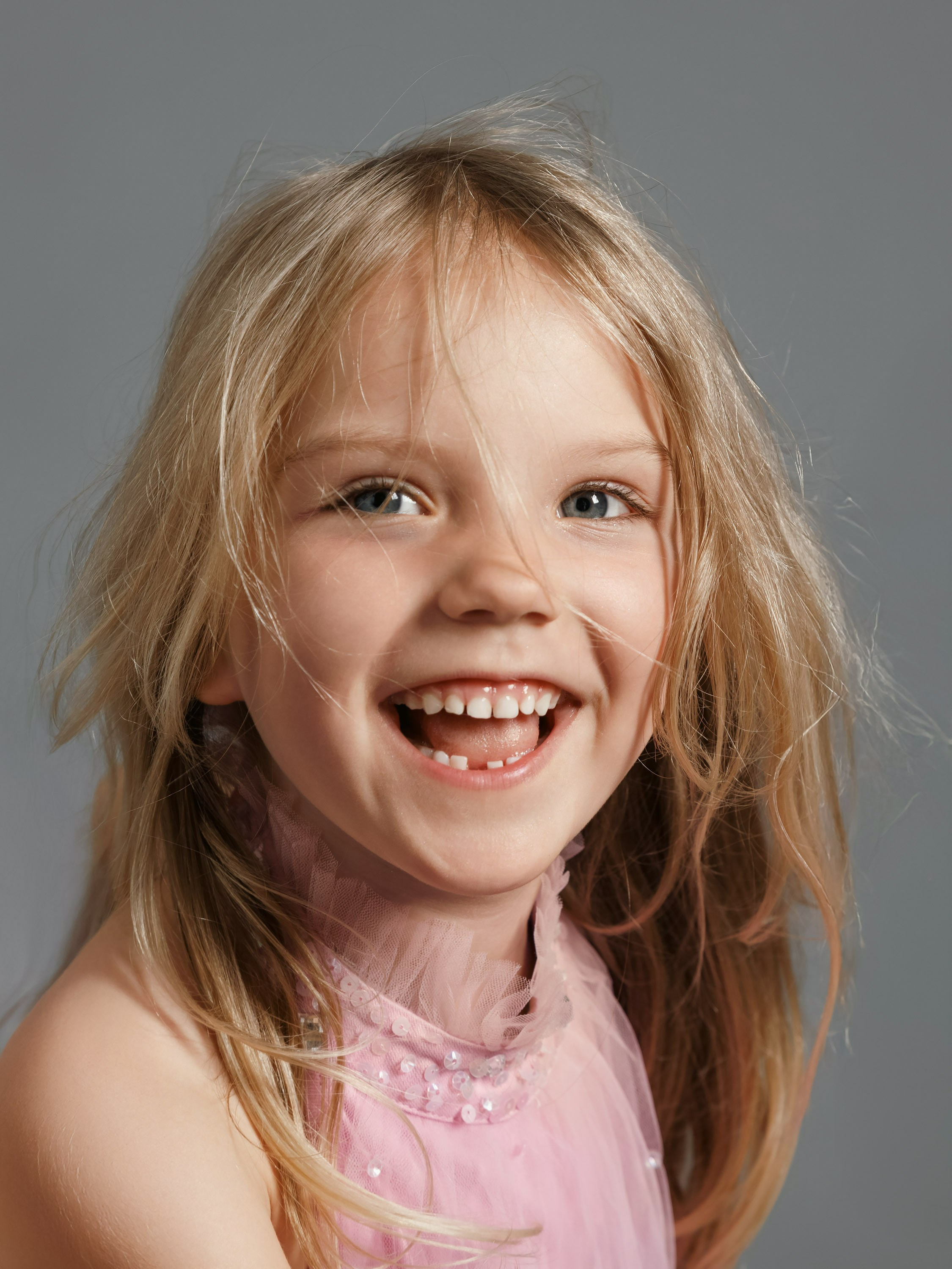 girl laughing, close-up portrait, studio