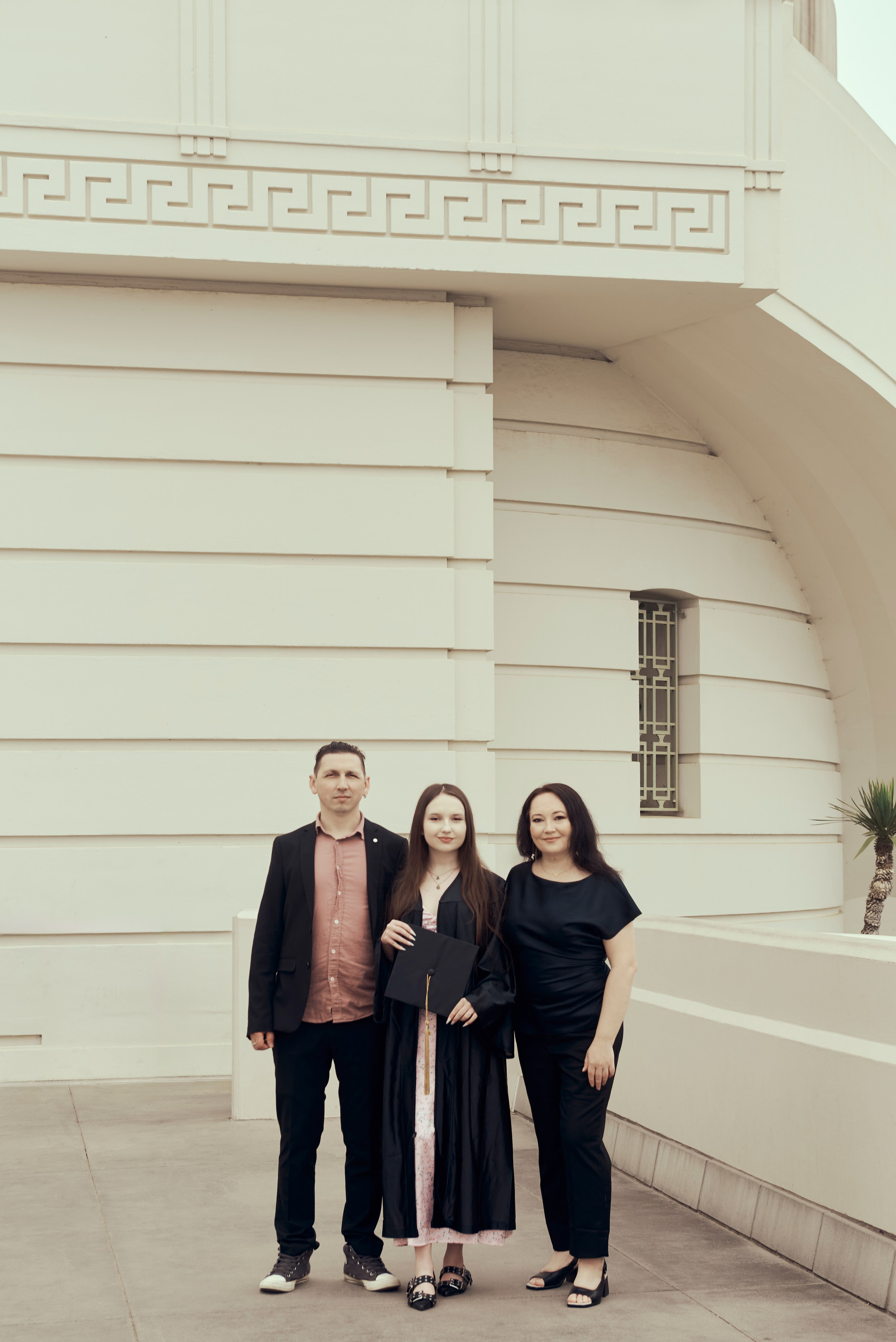 Candid shot of a graduate laughing and celebrating at a Los Angeles café
