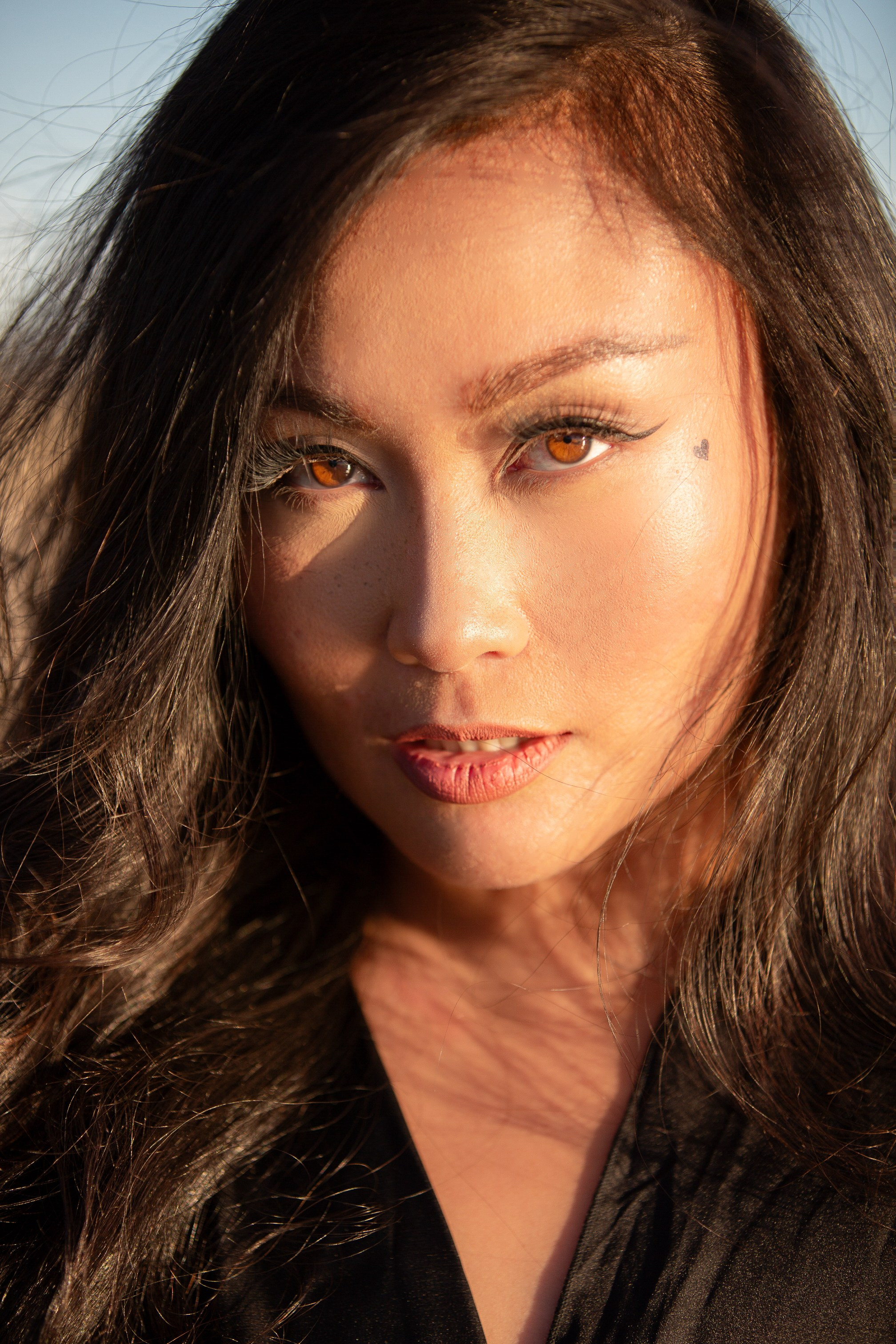 Individual photoshoot by the water in Windsor, blending creative angles and natural surroundings for a breathtaking portrait.
