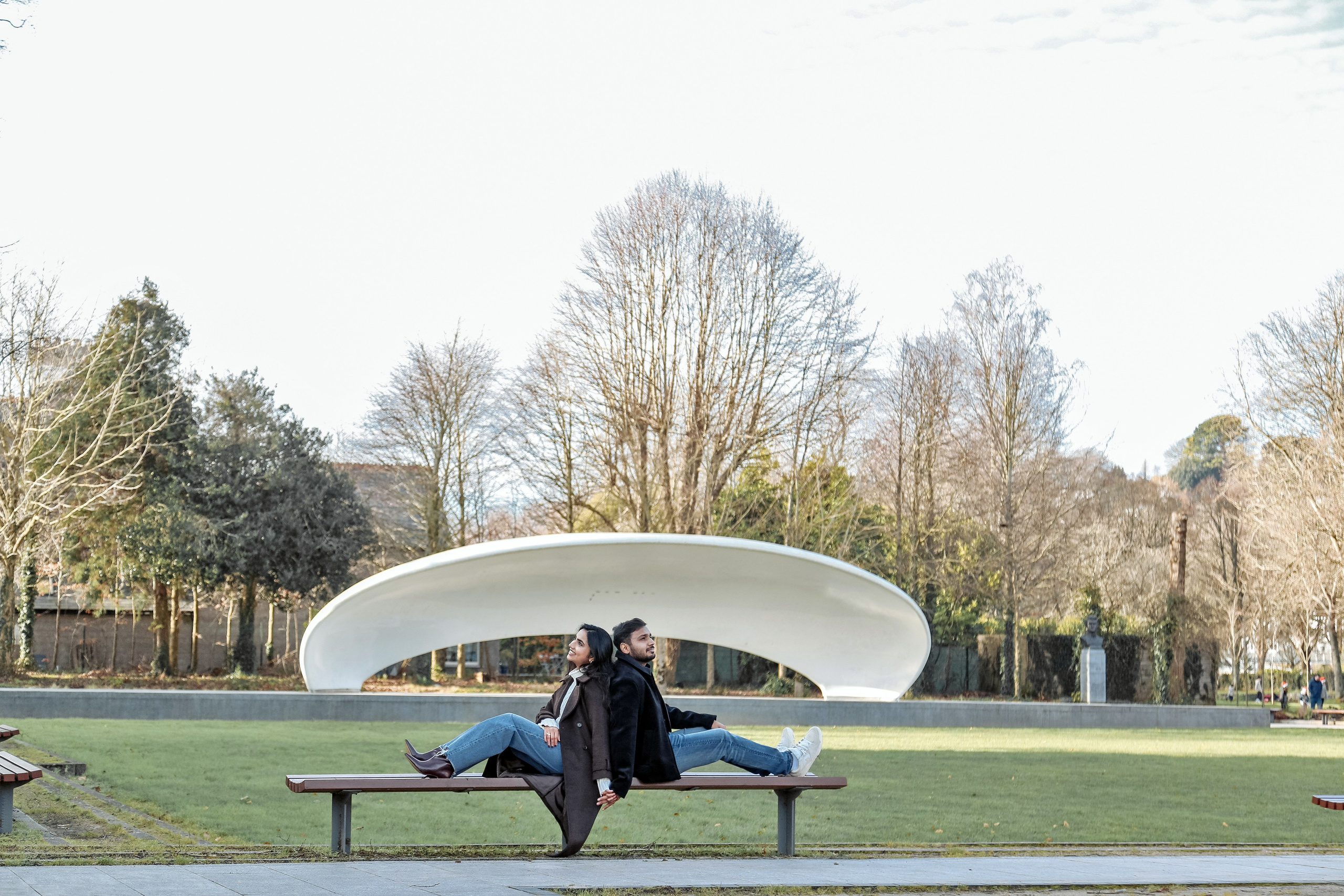 A modern and playful portrait that balances togetherness and individuality within a striking architectural frame.