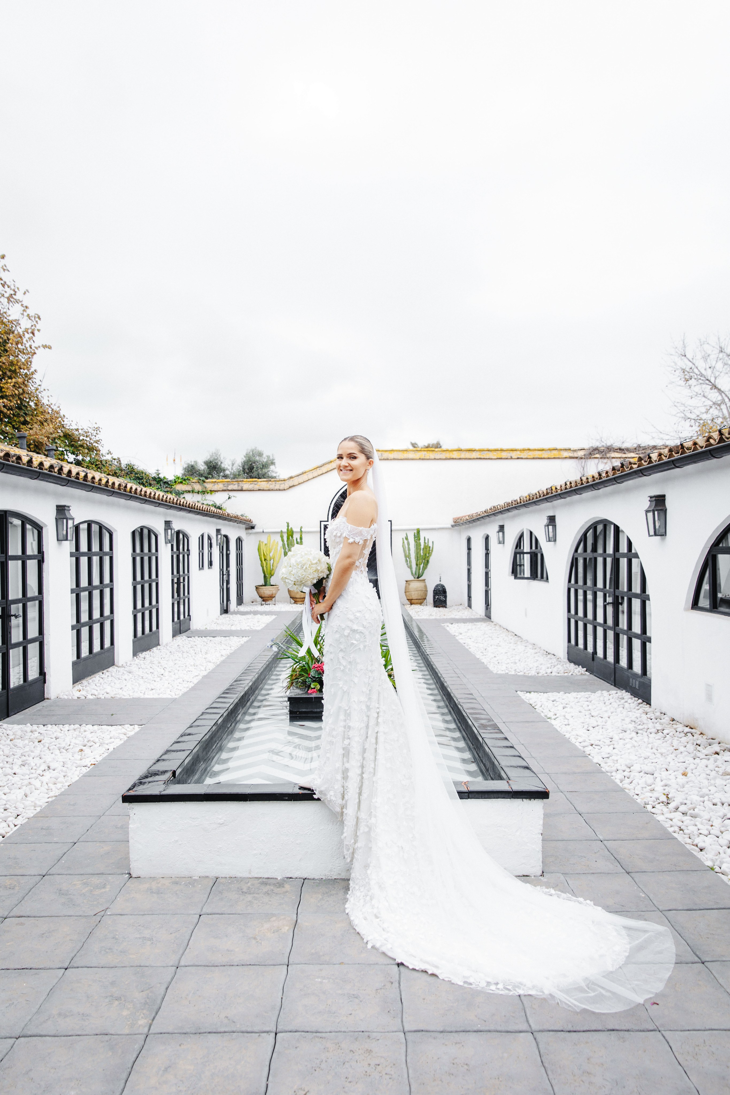Glamorous bridal beauty shot highlighting dress and flowers for a destination wedding in Barcelona