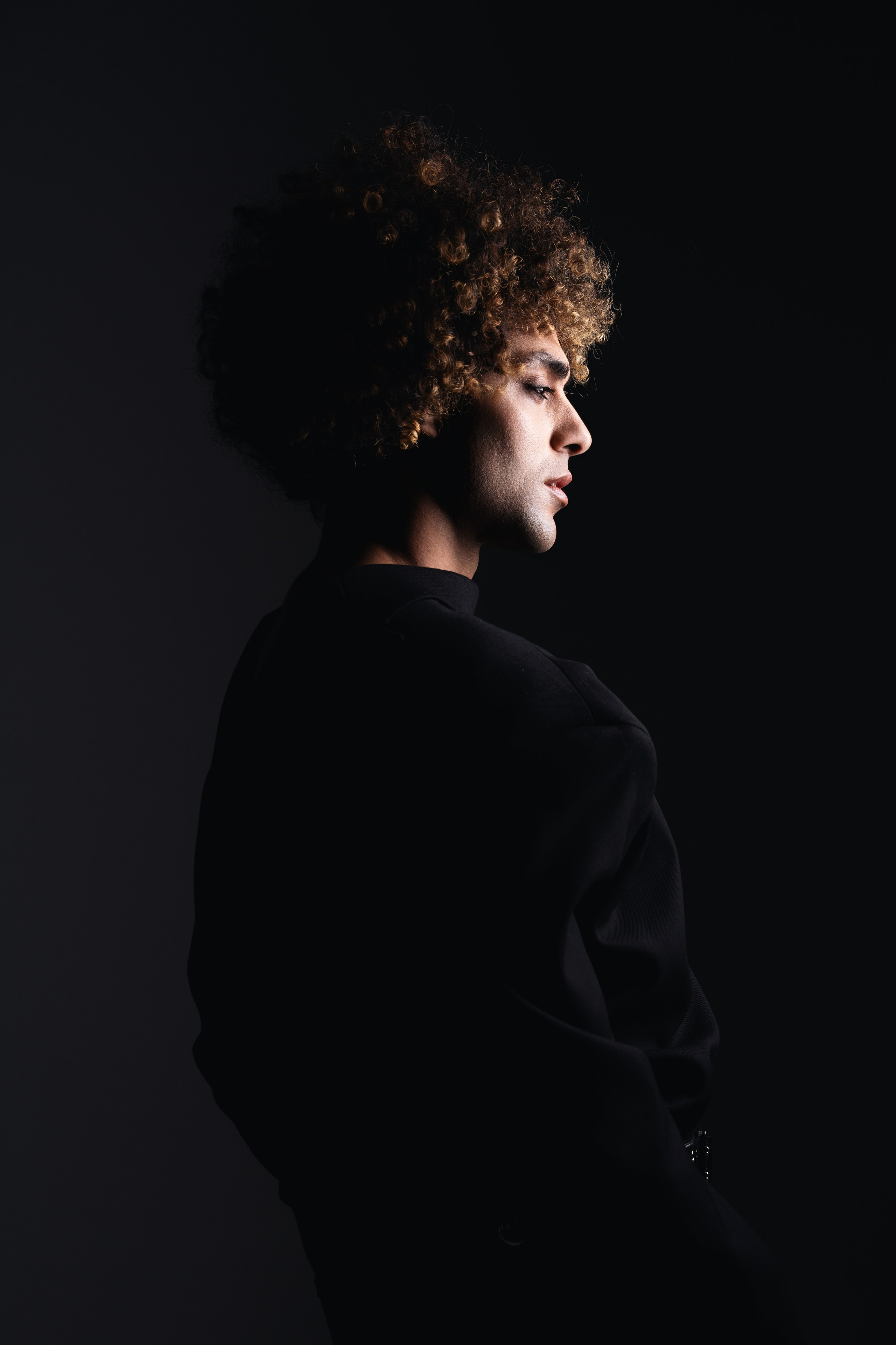 Studio Portrait Session in London – A portrait session conducted in a studio in London, with controlled lighting to create a dramatic effect.