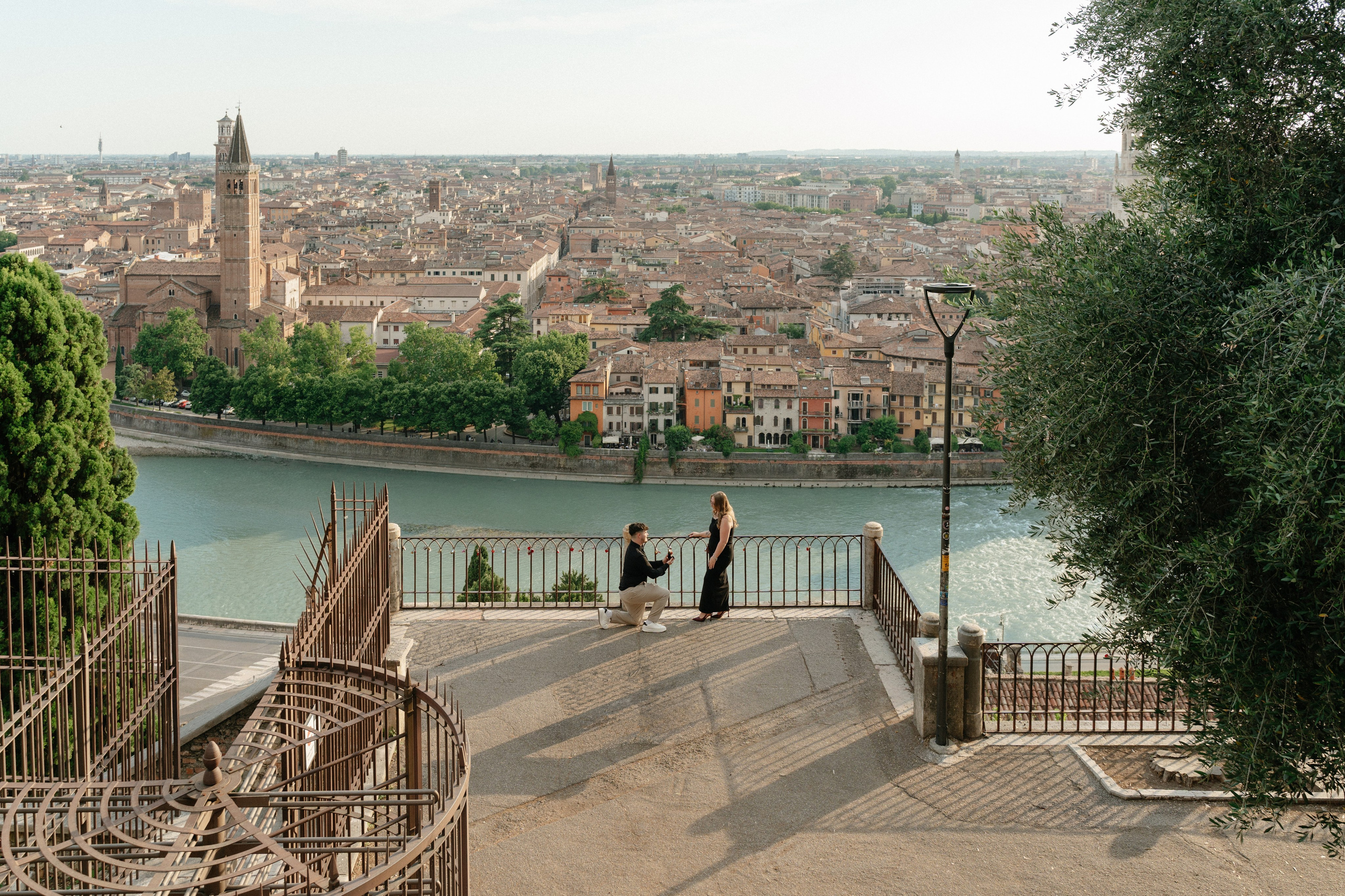 Surprise marriage proposal at Castel San Pietro overlooking Verona, Italy