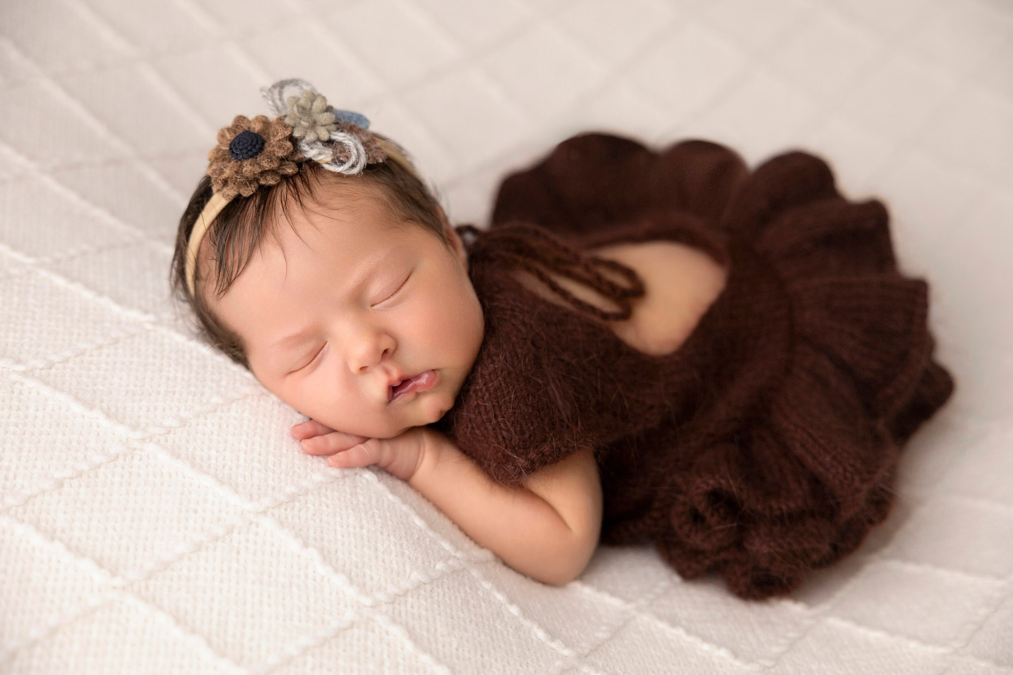 newborn photoshoot? baby in brown angora knitted dress