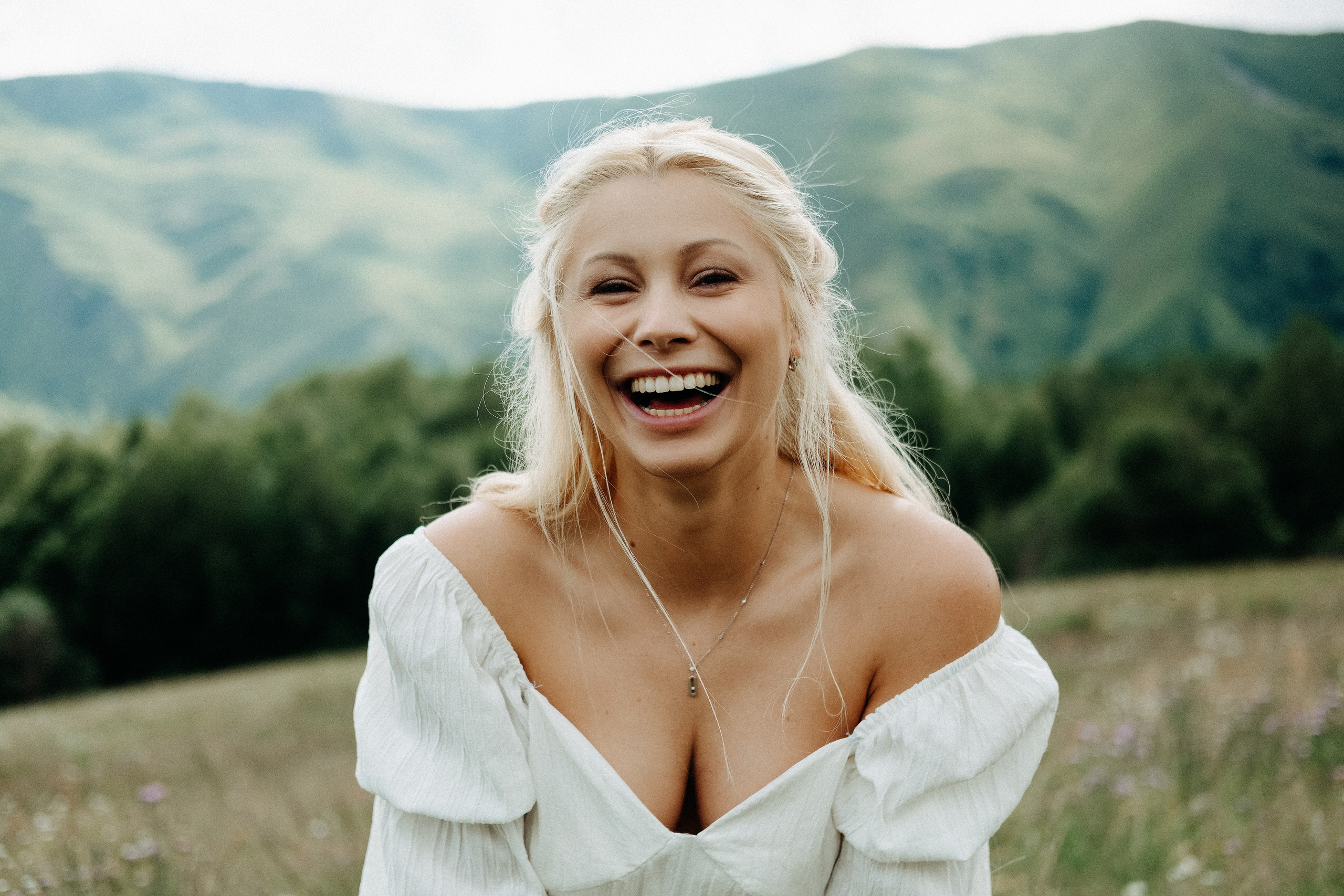 Emotional female portrait in mountain scenery