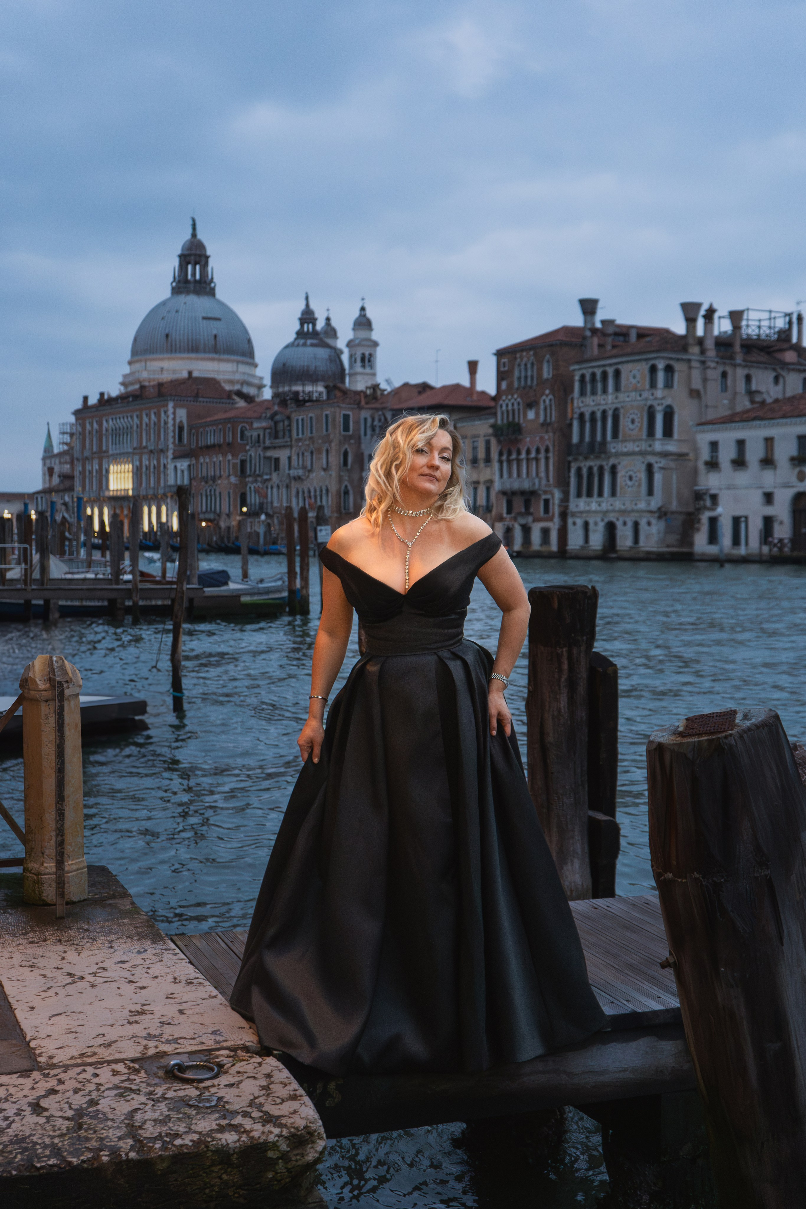Branding photoshoot Venice for blogger in silk dress near Grand Canal