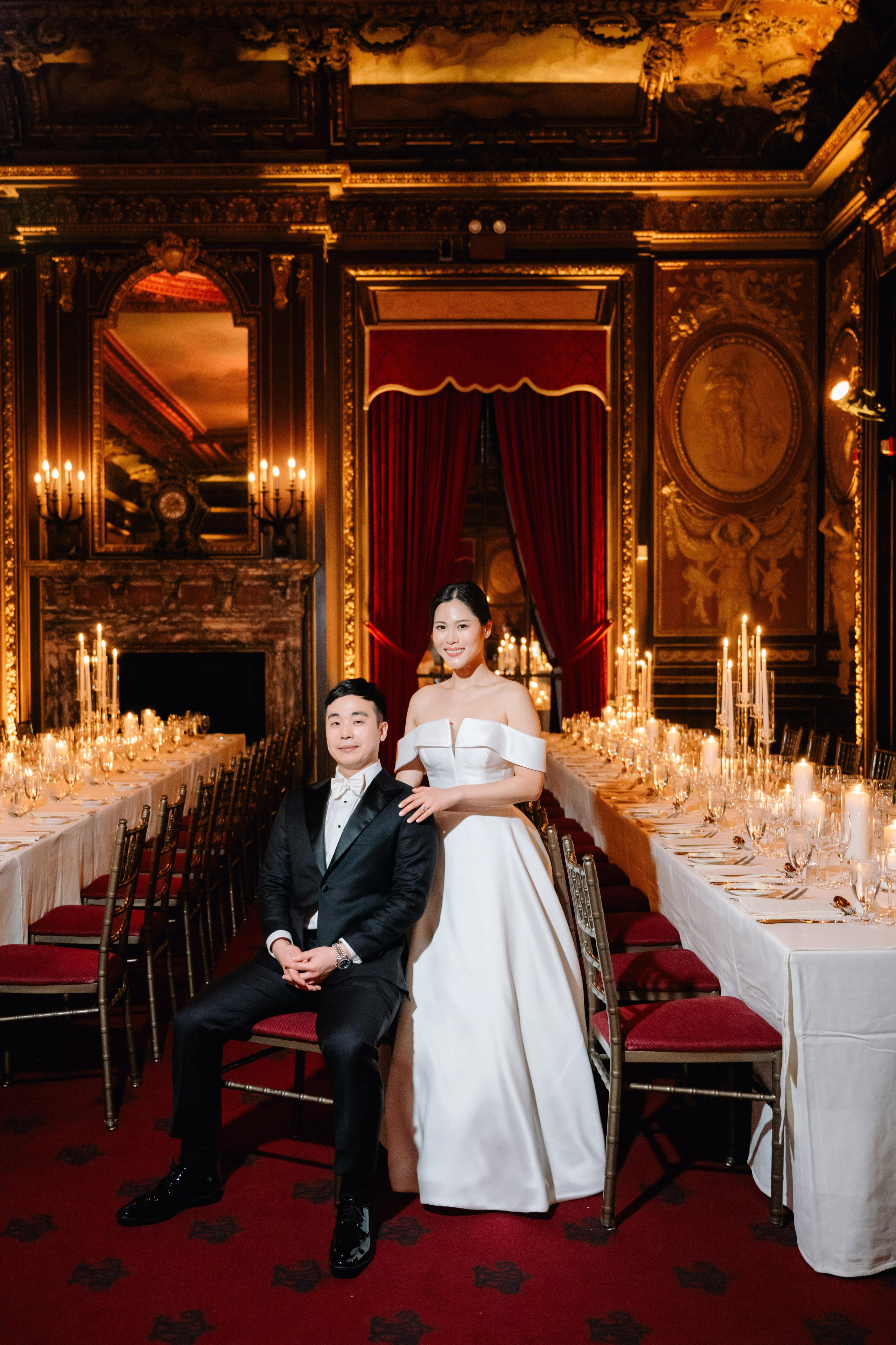 a bride and groom sitting at a table