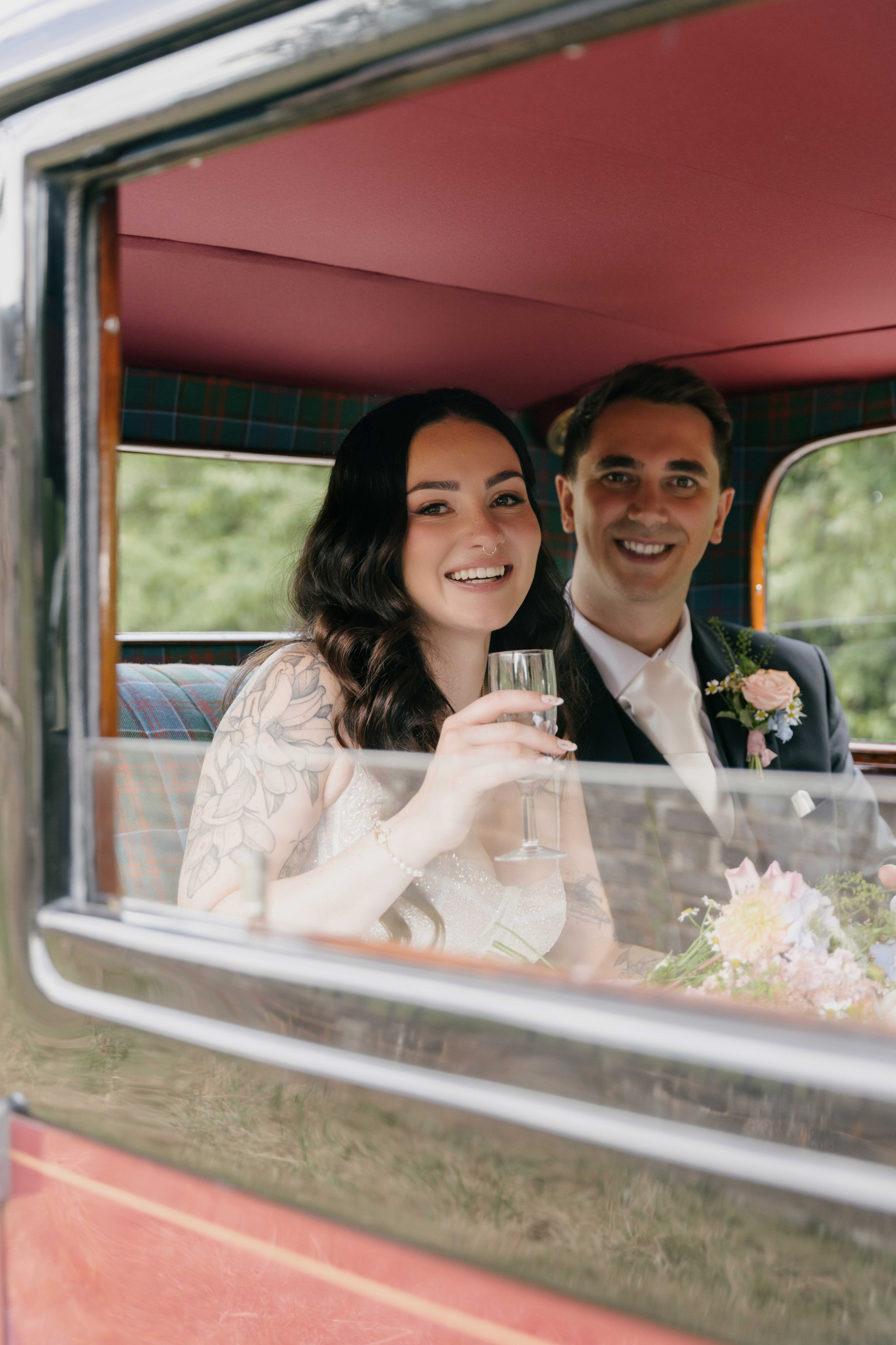     bride and groom in vintage car Essex wedding