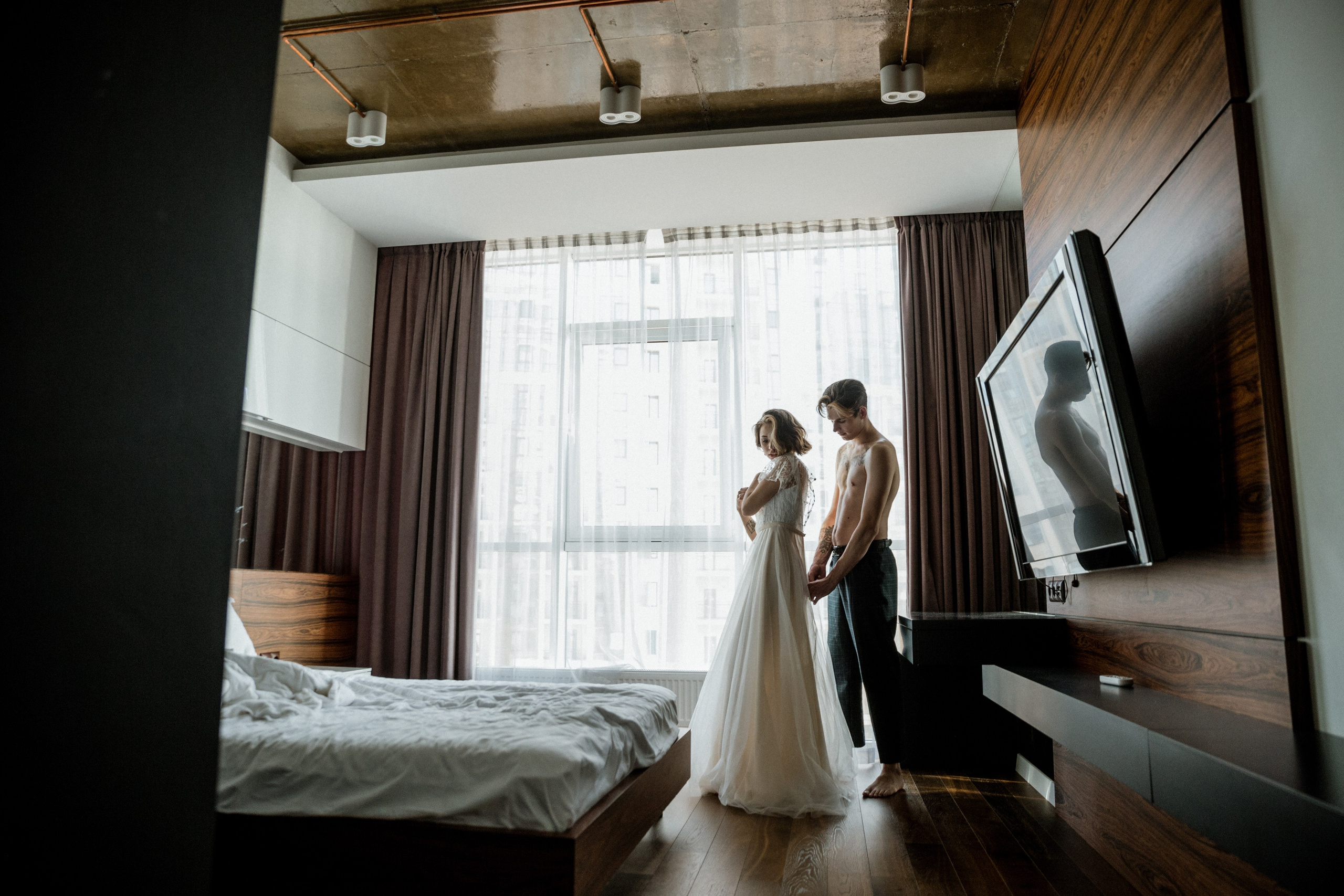Bride getting ready boudoir style before seaside ceremony, wedding photography France