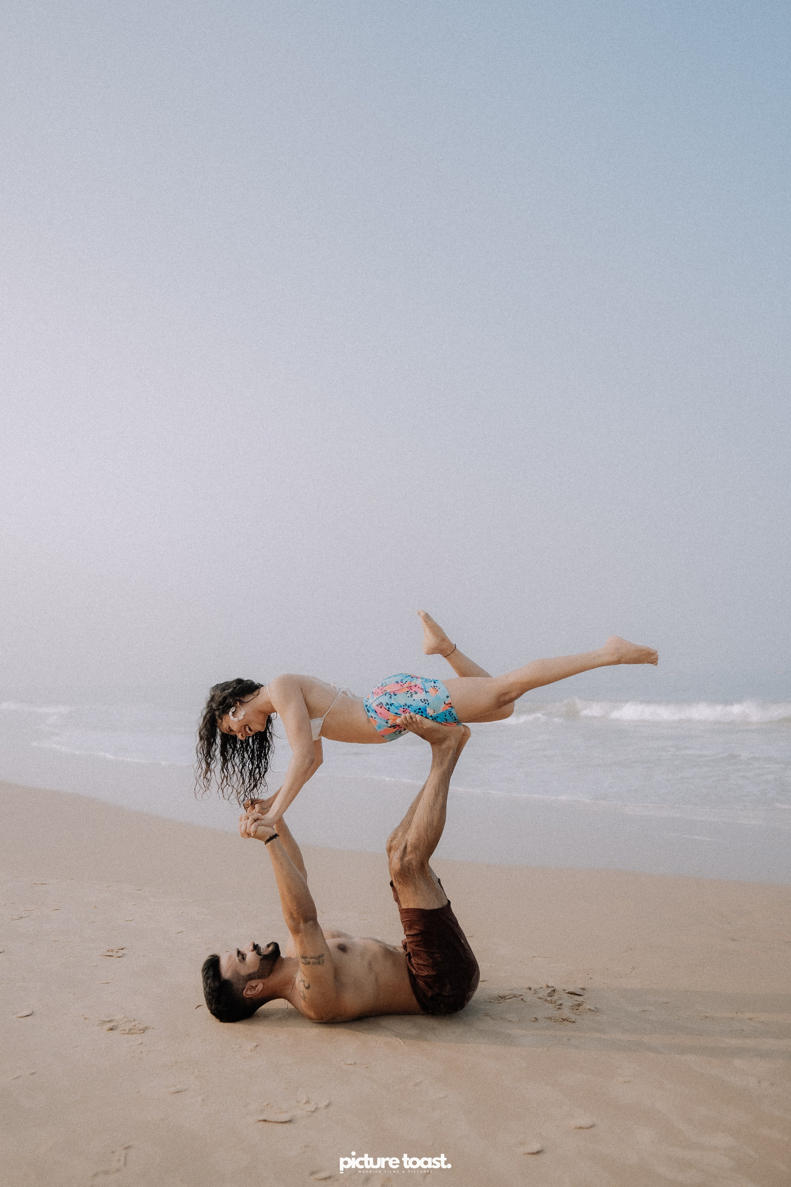 Love In The Beach. Fine art Wedding Photographers in India & Canada