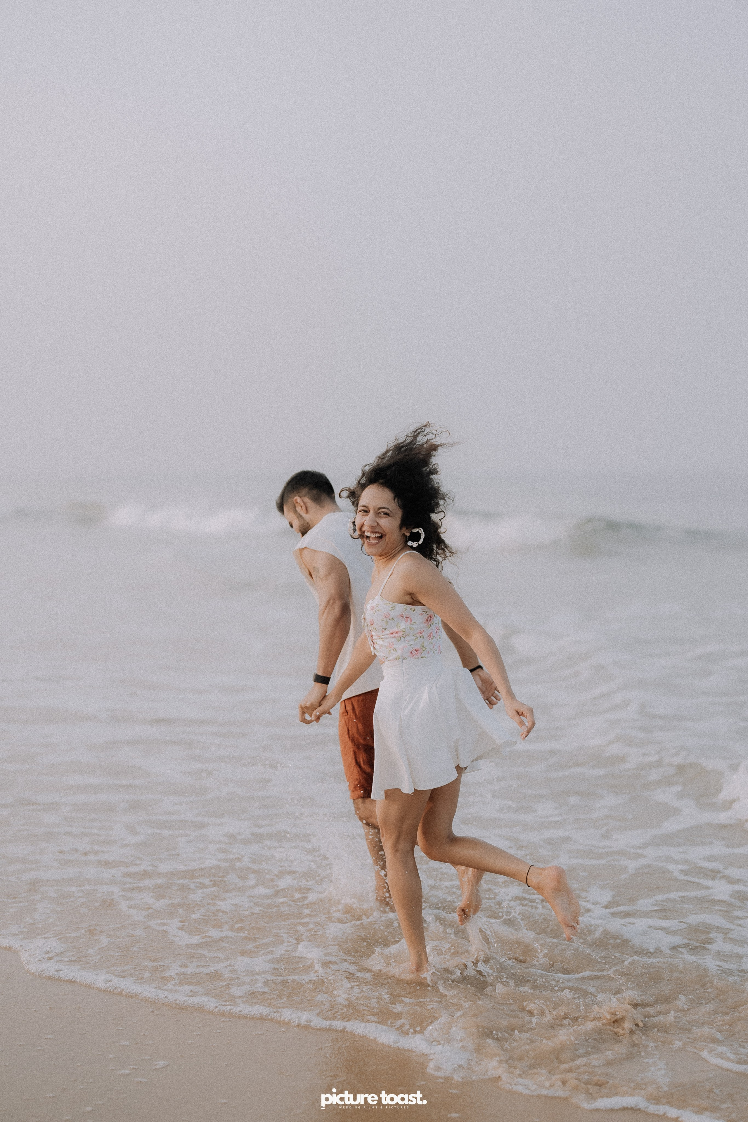 Love In The Beach. Fine art Wedding Photographers in India & Canada