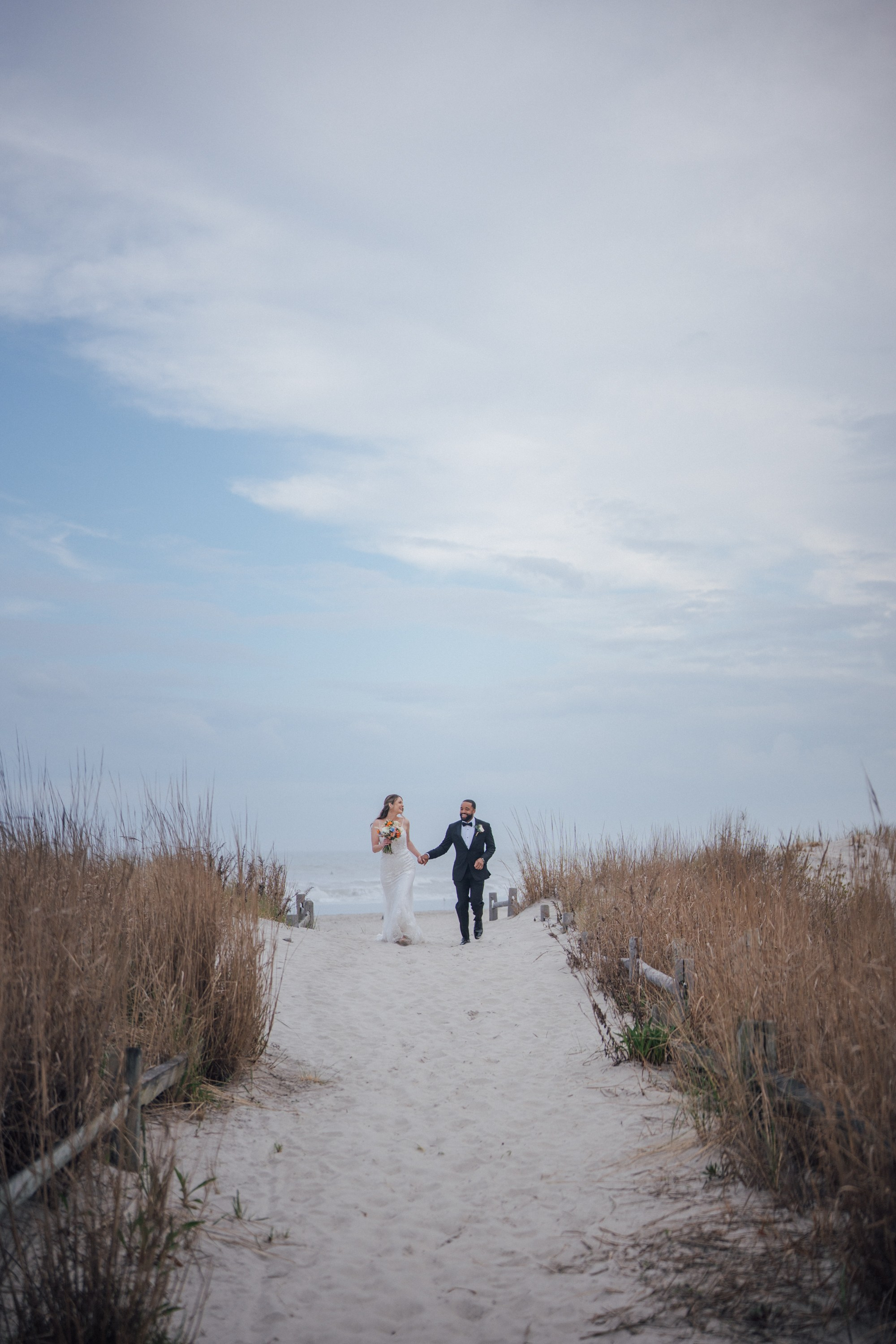 Wedding walk on the beach. Portrait and wedding photographer in New York
