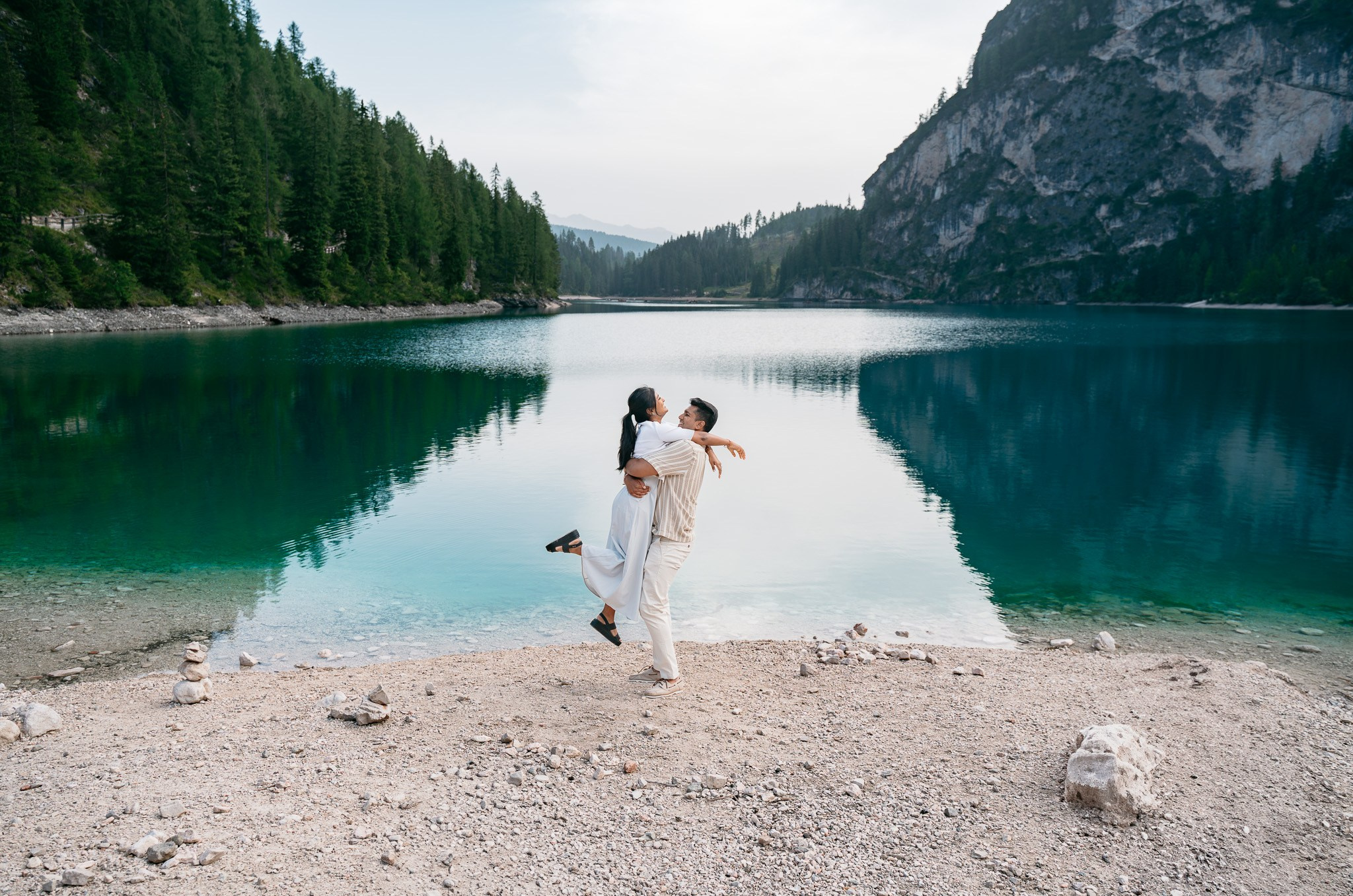 Private early morning proposal overlooking the emerald water of Lake Braies, Italy.