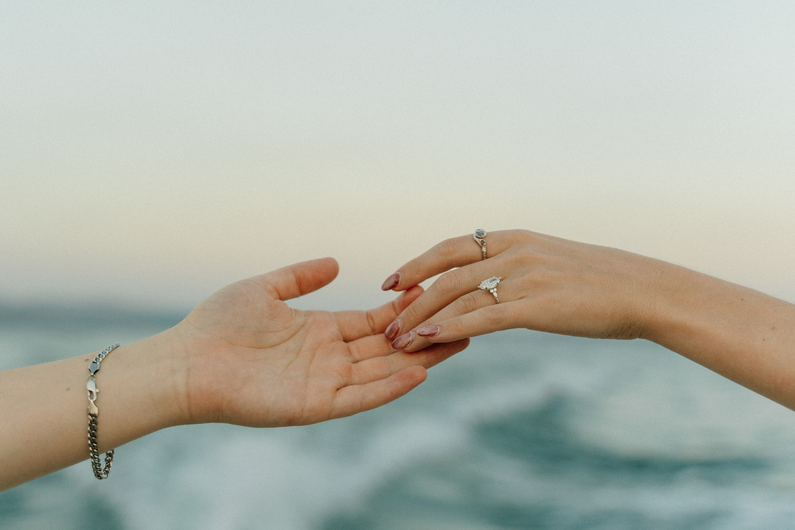 Romantic luxury boat proposal in Italy with panoramic views of Lake Garda and Sirmione Castle.