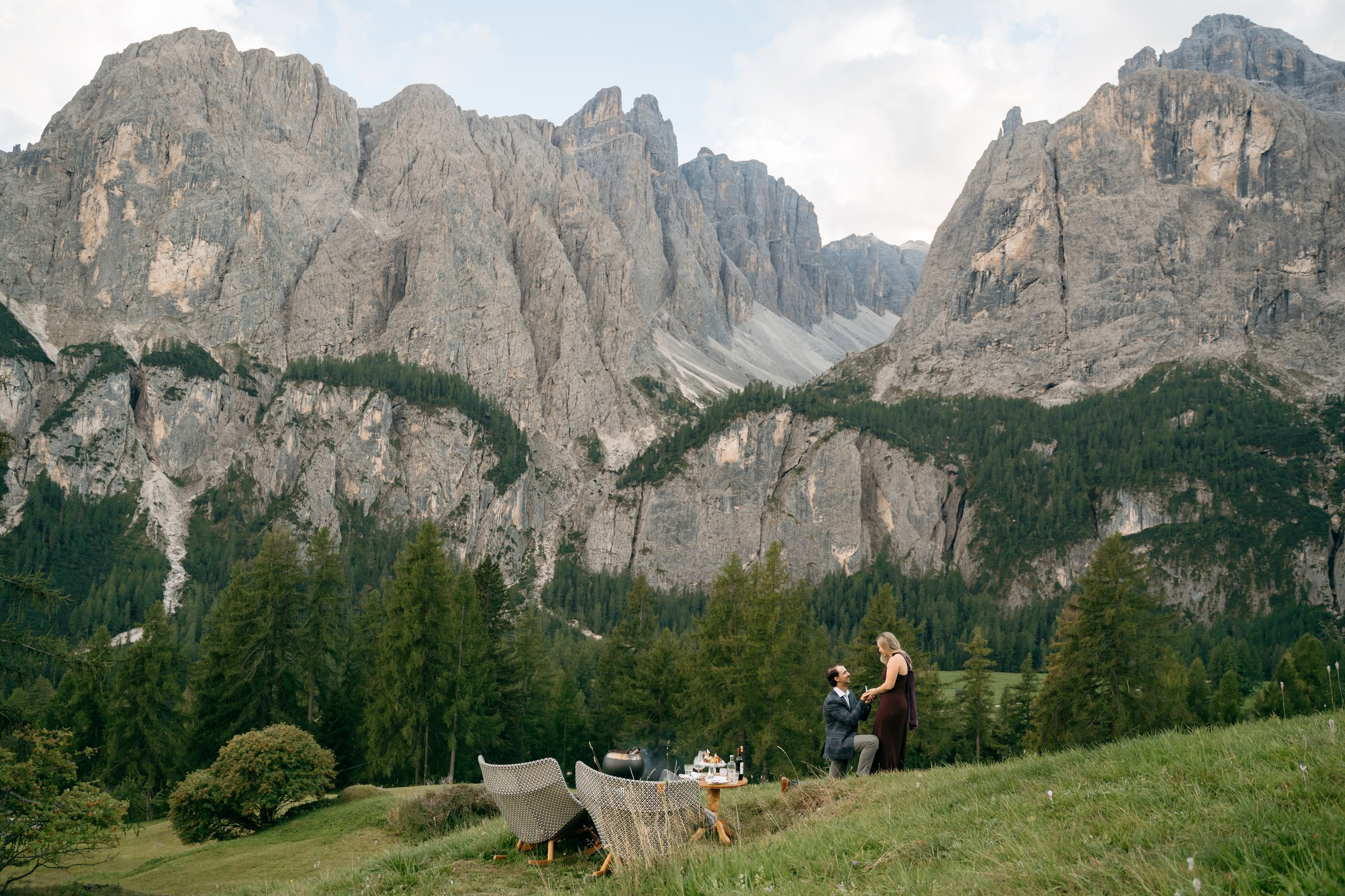 Intimate marriage proposal with mountain views at Kolfuschgerhof Mountain Resort in Colfosco, Dolomites.