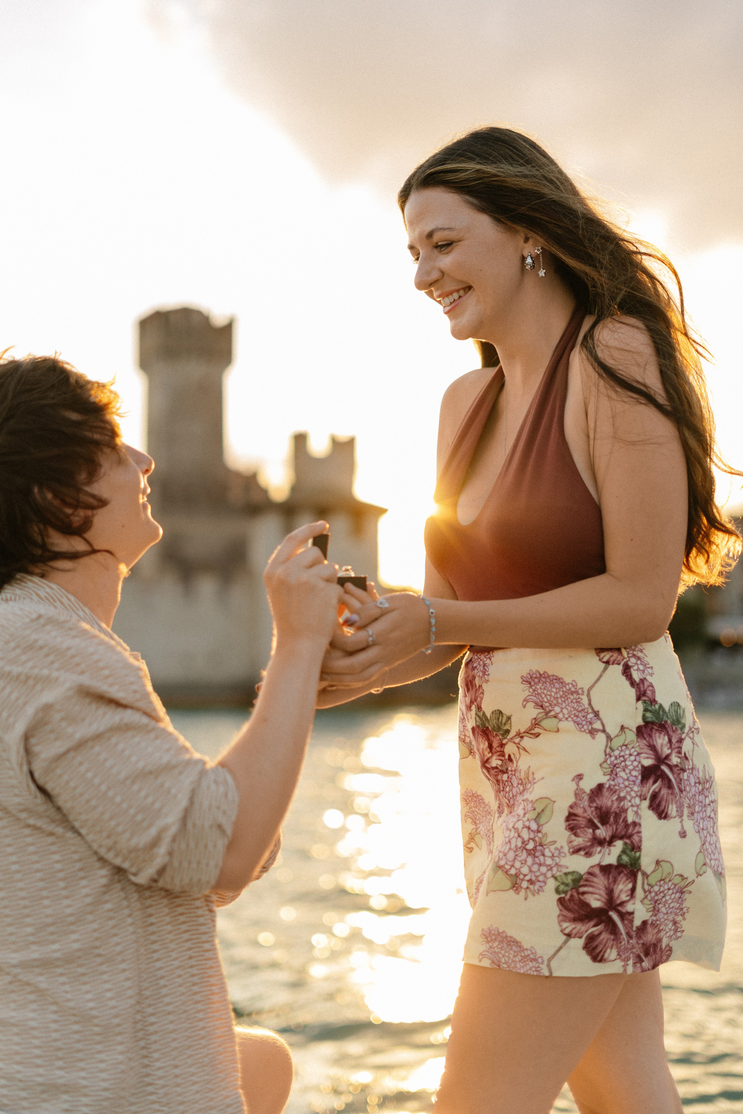romantic Lake Garda proposal aboard a luxury boat during golden hour in Sirmione.
