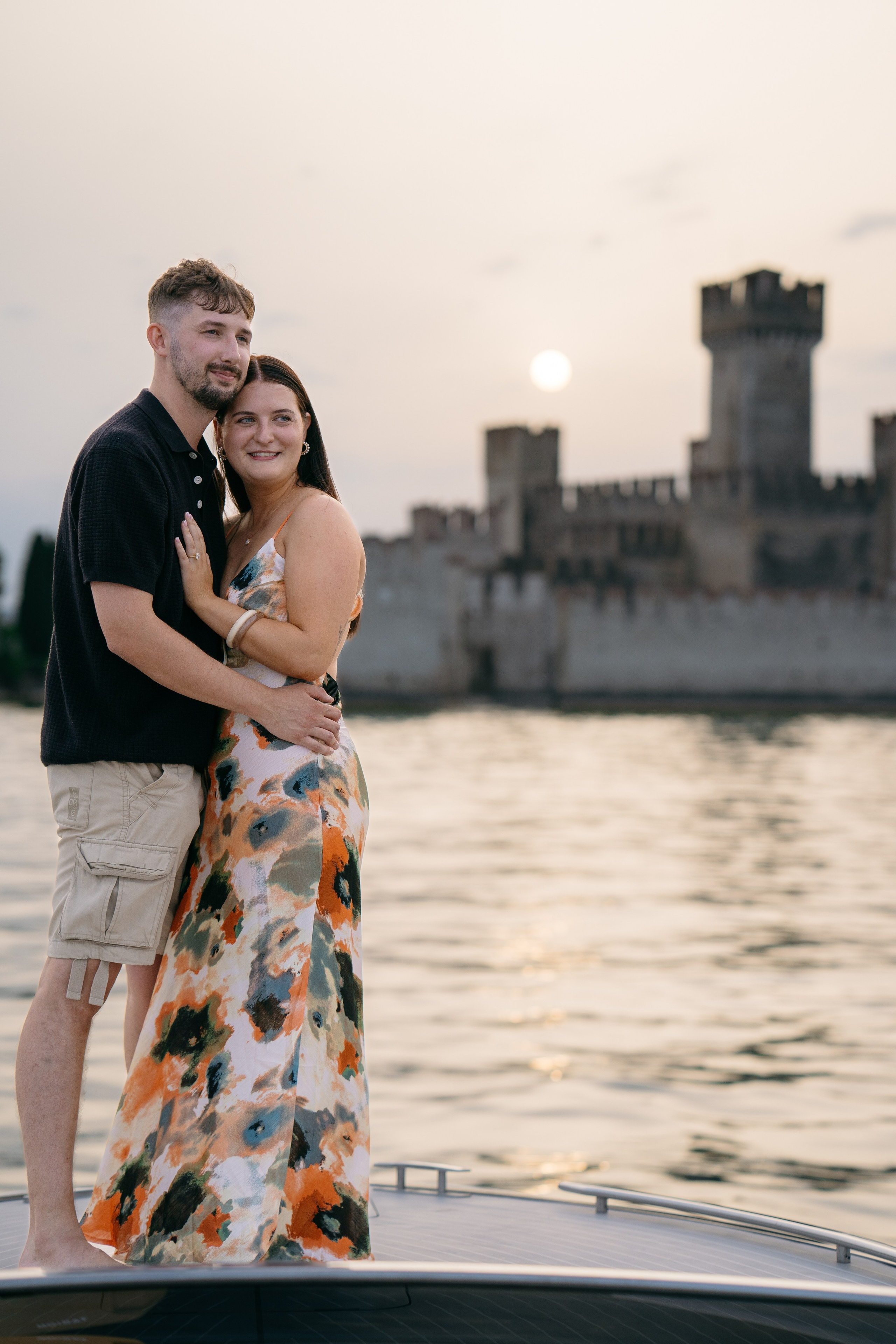 Golden evening light reflecting on the water during a romantic boat experience in Sirmione.