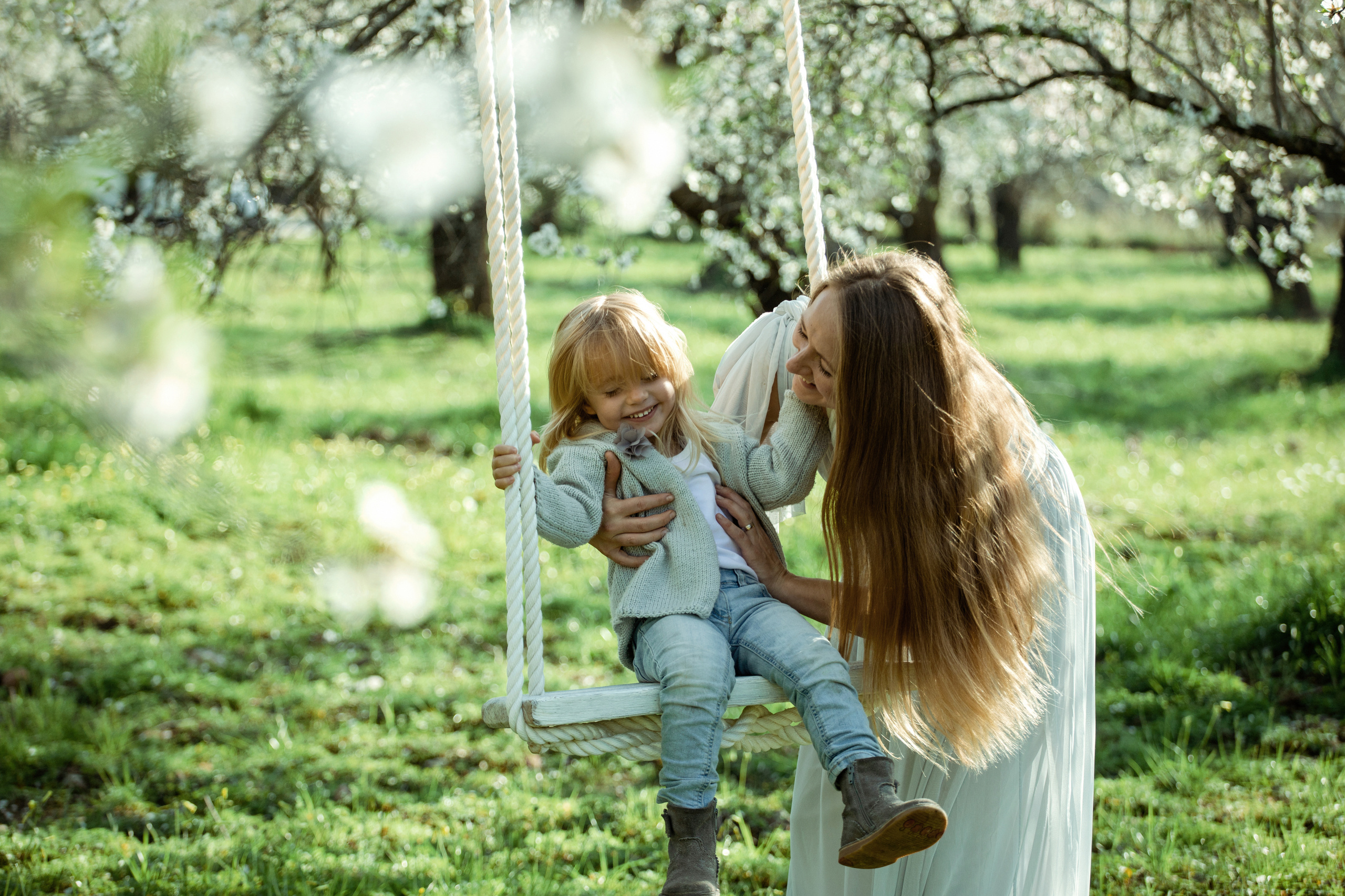 Family photo session in a flowering almond garden. Julia Ganch I Fashion Wedding Photography I Cappadocia Turkey