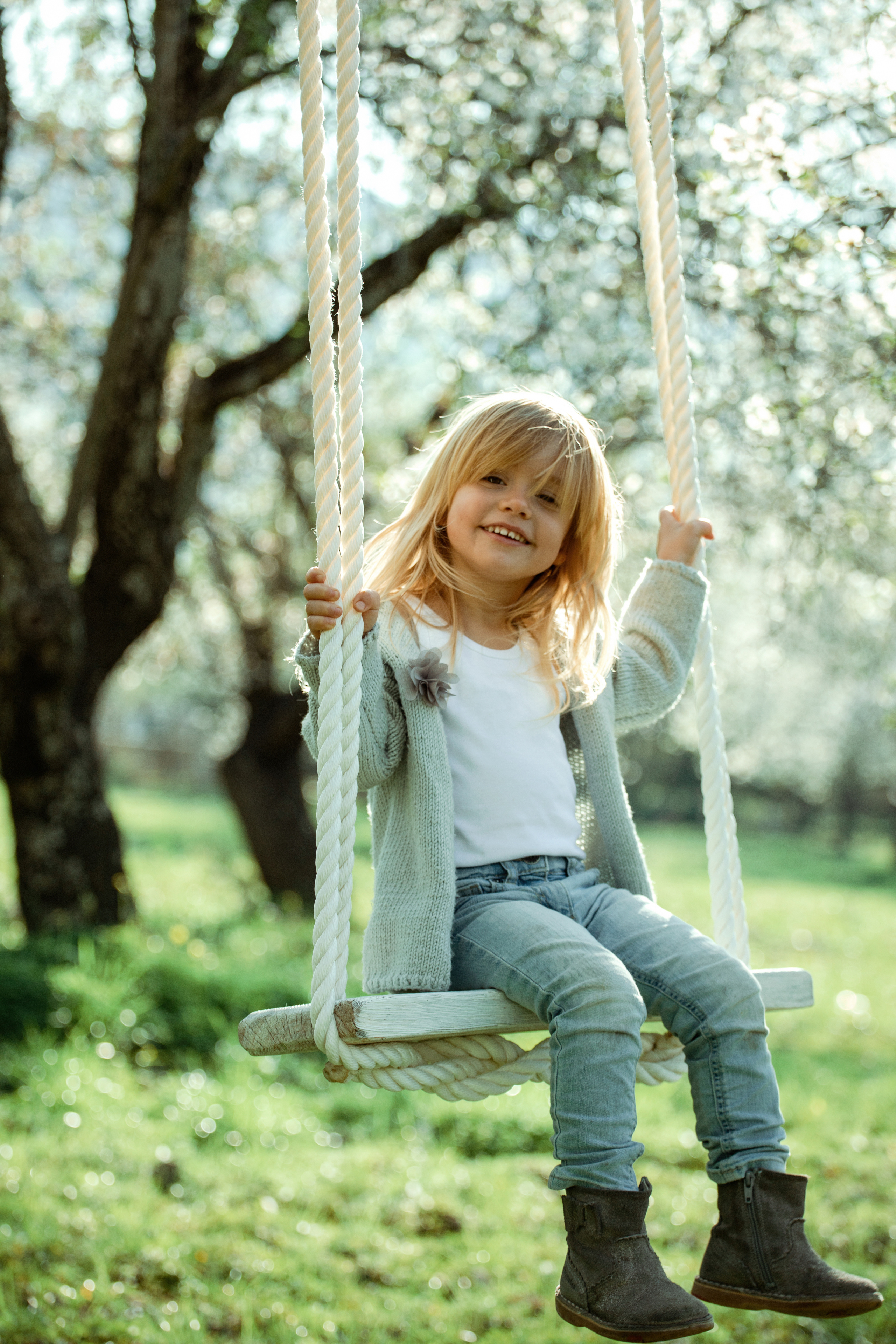 Family photo session in a flowering almond garden. Julia Ganch I Fashion Wedding Photography I Cappadocia Turkey