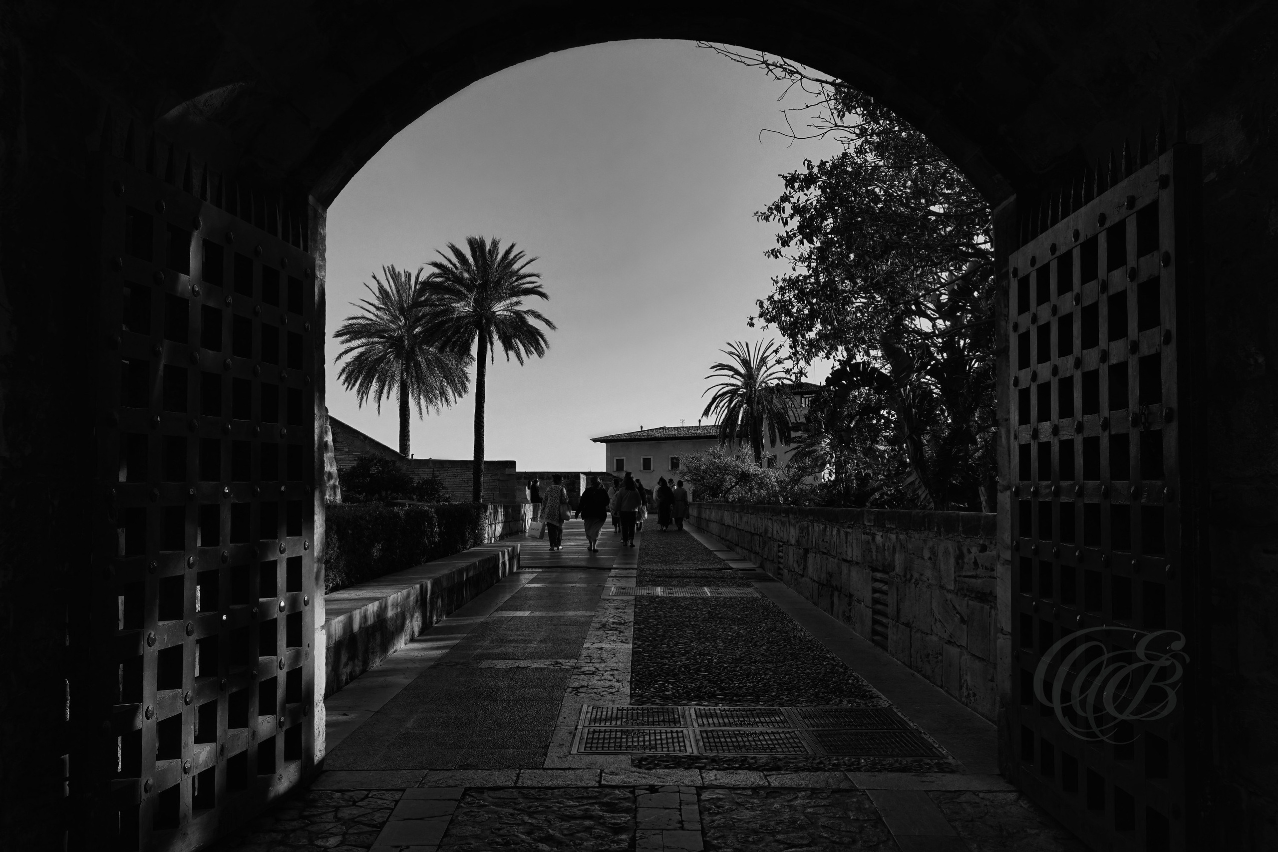 The Royal Palace of La Almudaina remains one of Palma’s most significant historic landmarks, with origins that trace back to the island’s Islamic period before later becoming a royal residence after the conquest of Mallorca in 1229. The Black and White presentation emphasizes the architectural lines, textures, and historic character of the structure, offering a more timeless interpretation of one of the Balearic Islands’ most recognized monuments. Eduardo Bartoli Photography.
