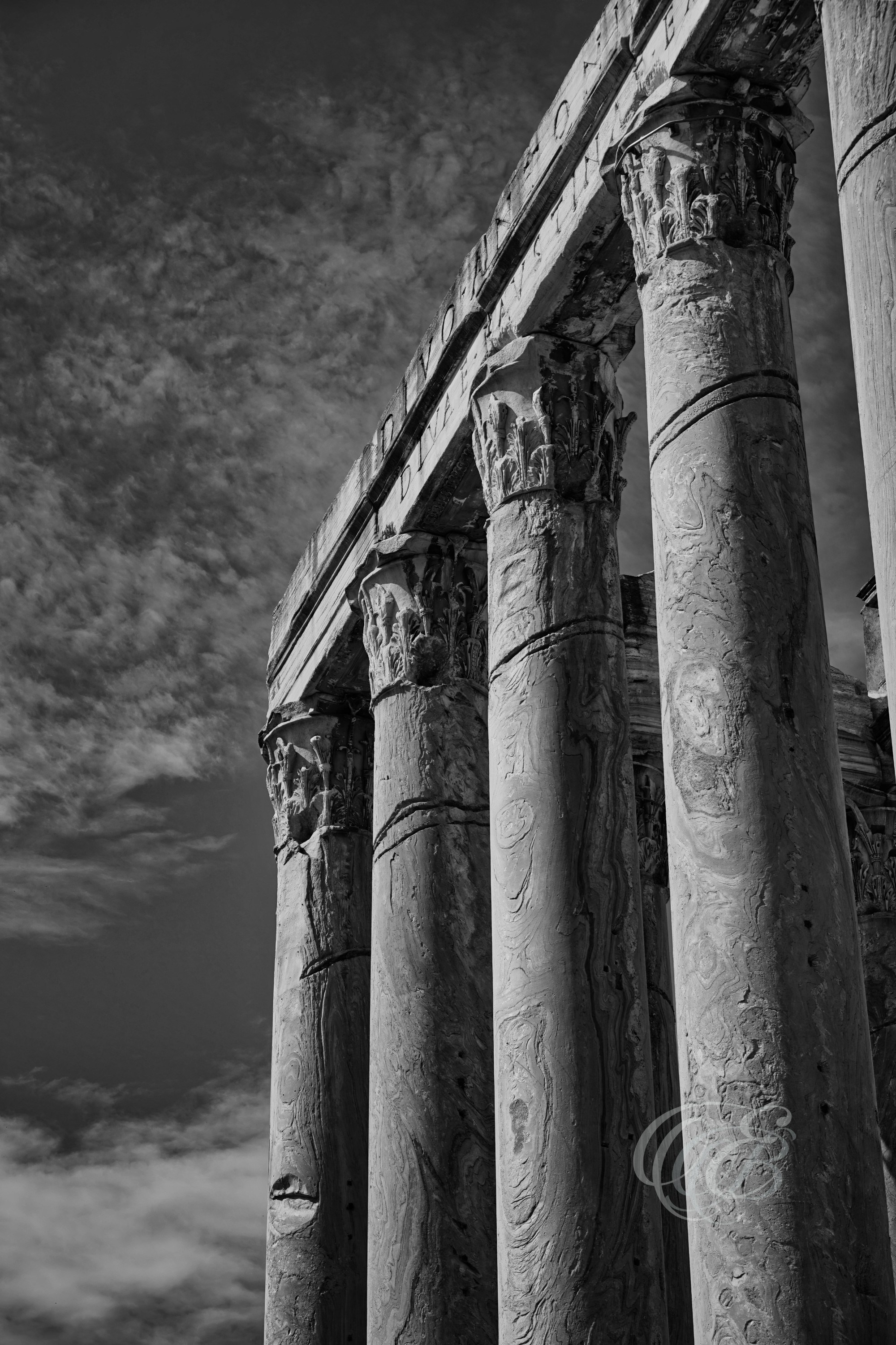 Rome Italy - Temple of Antoninus & Faustina - B&W - Eduardo Bartoli Photography - Black and white photograph of the Temple of Antoninus and Faustina in the Roman Forum, Rome, Italy, built in the 2nd century AD and later incorporated into the Church of San Lorenzo in Miranda – photography by Eduardo Bartoli.